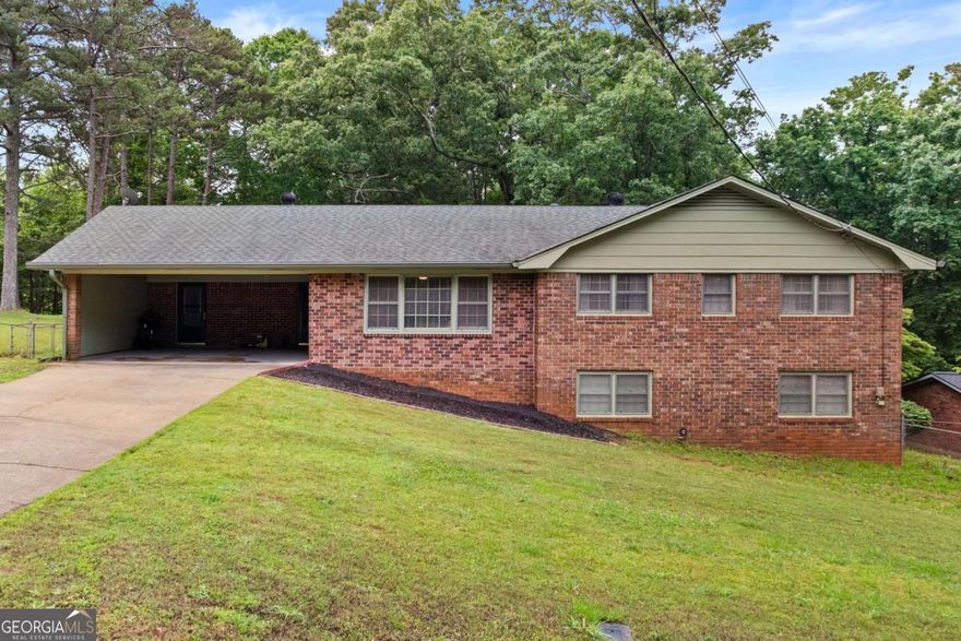Welcome to this beautifully updated all-brick ranch home nestled on nearly an acre lot, backing up to protected Corps of Engineers land on Lake Lanier. This 3-bedroom, 2.5-bath home offers the perfect blend of privacy, charm, and convenience to shopping and the UNG Gainesville campus. Enjoy an open and airy floor plan with modern updates throughout, plus a partially finished basement ideal for a home office, gym, or bonus room. It also has a screened back porch. Part of the backyard is fenced, perfect for pets or play, while the wooded portion provides serene natural views and extra privacy. New crawlspace encapsulation and radon remediation system installed.  Walk out of your backyard to the lake with a canoe or paddleboard to enjoy! Don't miss this opportunity for peaceful living with no HOA!