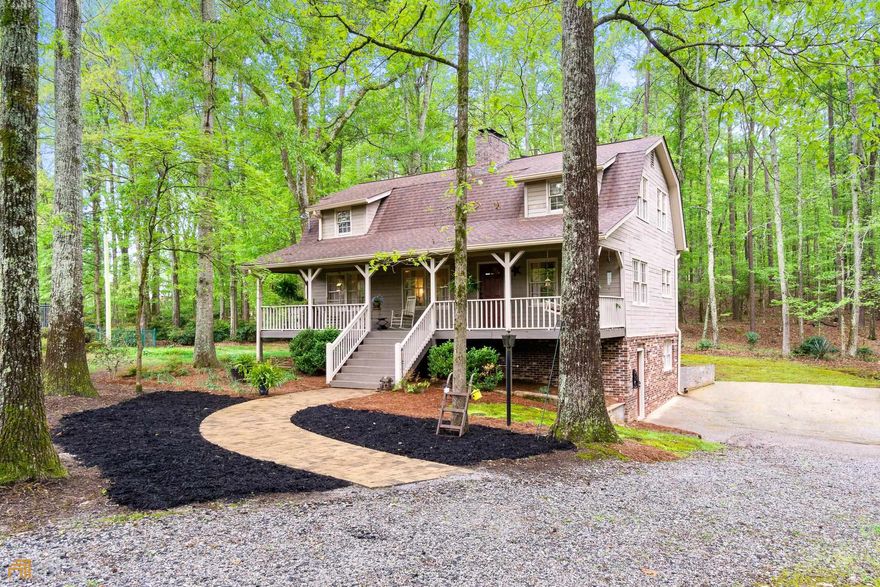 What an absolutely charming home! This one owner home includes 3 bedrooms 2 1/2 bath home and sits on 3.6 private wooded acres, check out the wildlife from your screened in back porch or enjoy the inground swimming pool just in time for summer. Step from the inviting covered front porch into the spacious living area witch offers so much character including open rafter ceilings. Hardwood floors can be found throughout the main level. An impressive brick masonry fireplace is a natural focal point with wood stove or can connect to natural gas. First floor also includes a separate dining room with a continuation of the open rafters, half bath with new tile, laundry room, and kitchen with stainless steel appliances. Upstairs offers 2 huge bedrooms and a full bath with new tile flooring. One bedroom could be converted to two. Basement offers a bedroom, updated full bath with tile surround shower plus living area with another brick masonry fireplace. New LVP flooring finishes out the basement level. Exterior is finished with Vermont Weatherboard. Must see this adorable home to fully appreciate all of its unique features.