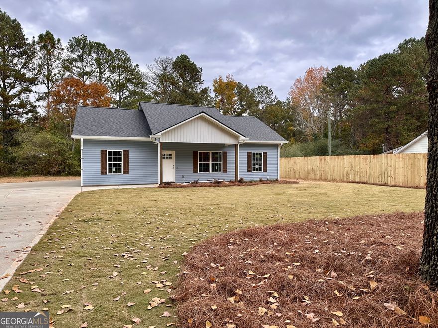Almost Complete, be in your new home before Christmas! Seller is offering $5000 in incentives to the buyer! 3 Bed 2 Bath stepless ranch situated on .71 acre lot with a private back yard, NO subdivision, NO HOA! Inside, you'll find upgraded luxury vinyl plank flooring-no carpet here! The main living area boasts vaulted ceilings, creating an open and airy atmosphere. The kitchen features beautiful granite countertops,  shaker-style cabinets, and a spacious island, with all kitchen appliances included. The primary bedroom offers a generous walk-in closet and an en-suite bathroom with elegant marble countertops and a walk-in shower. All bedrooms are equipped with ceiling fans for added comfort. Secondary bathroom also offers marble countertops. Step out onto the back patio and take in the view of the level backyard.  You can't beat this location! In less than a 20-minute drive, you can reach I-20 and the towns of Villa Rica, Dallas, Rockmart, Temple, or Buchanan. Interior photos are from a previous build with similar finishes. Same floor plan.