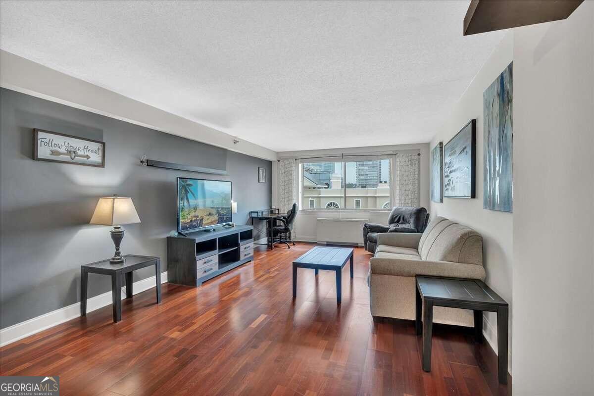 Discover urban sophistication at its pinnacle in this exquisite 1-bedroom condo nestled on the 9th floor of the prestigious Parklane on Peachtree. Unit 907 offers an unparalleled living experience with breathtaking, unobstructed views of Atlanta's iconic skyline. Step into your personal sanctuary, where modern elegance meets comfort in every detail.  Bathed in natural light, this meticulously maintained residence boasts an open-concept layout perfect for both relaxation and entertaining. The gourmet kitchen, adorned with sleek granite countertops, will inspire your inner chef. Retreat to the spacious bedroom, a tranquil haven with ample closet space and stunning city vistas.  Tech enthusiasts will appreciate the availability of lightning-fast Google Fiber, ensuring seamless connectivity for work or leisure. Enjoy the convenience of a reserved parking space, a coveted amenity in bustling Buckhead. Pet owners will delight in the building's dog park, perfect for furry companions.  Parklane on Peachtree elevates luxury living with its impressive array of amenities. Maintain your fitness regimen in the state-of-the-art gym, unwind in the serene common areas, or host meetings in the dedicated conference room. The secure package delivery area ensures your deliveries are always safe and accessible.  Perhaps the most enticing feature is the comprehensive HOA dues, which cover water, sewer, trash, electricity, natural gas, and common area pest control. This all-inclusive package allows for a truly worry-free lifestyle in the heart of Atlanta's most desirable neighborhood.  Immerse yourself in the vibrant Buckhead scene, with world-class dining, shopping, and entertainment just steps from your door. This is more than a home; it's a lifestyle upgrade that puts you at the center of Atlanta's most exciting district. Don't miss this rare opportunity to own a piece of Buckhead's skyline. Schedule your private showing today and prepare to be captivated by the epitome of urban luxury living.