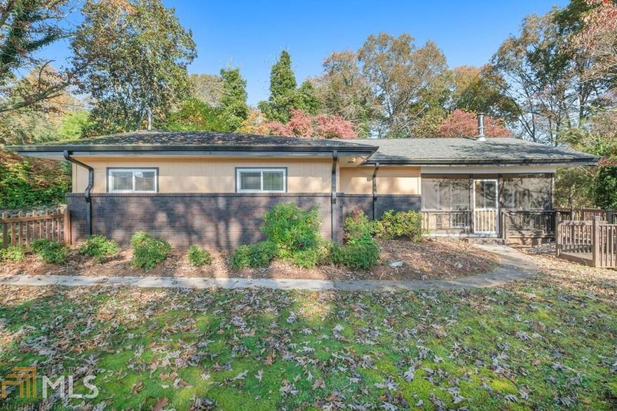 Pristine 1960's charm with modern update in a quiet, safe, friendly neighborhood close to the trendy restaurants and shops in the newly designed city of McCaysville, GA. Home has open floor plan that is energy efficient, large master with walk-in closet, extra large living room with wood stove and plenty of windows, modern kitchen with seasonal mountain view, dining area, separate spacious laundry room, screened porch, large deck, handy carport. Fenced in large back and side yard with plenty of room for gardening and pets. Property abounds with mature trees; Dogwood, Azalea and Rhododendron and a magnificent large oak tree in front yard. Charming rock wall lines the paved driveway as you enter the property. Bonus roomy finished basement with space for storage or would make a great workshop. Close to the conveniences of town and nearby Horseshoe Bend Park. A wonderful place to call home.