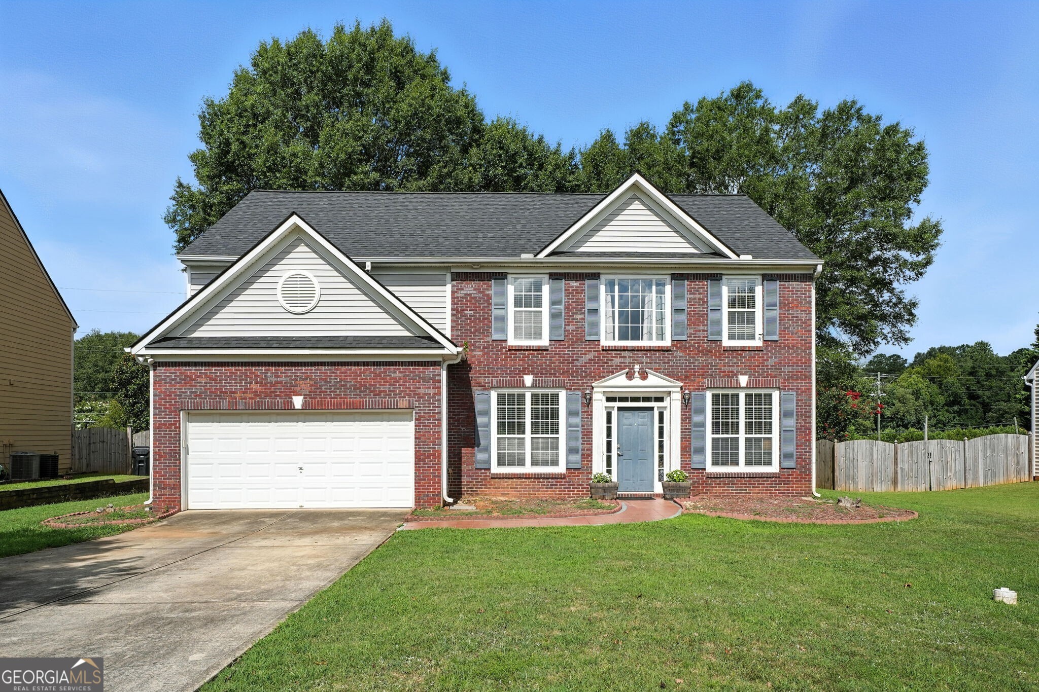 Welcome to this well-maintained brick front/vinyl-sided home featuring 4 spacious bedrooms and 2.5 bathrooms. The interior has been freshly painted and includes brand new carpet throughout. The updated kitchen offers a functional island, tile backsplash, custom soft-close cabinetry, tile flooring, high-quality appliances, and a pantry. Enjoy the warmth of the family room with a gas-log fireplace and hardwood flooring. Additional living spaces include a formal dining room, a separate living room, and a flexible office or workout room. Upstairs, a loft area provides extra space for a variety of uses. The oversized primary suite features vaulted ceilings, a large walk-in closet, and an en-suite bathroom with double vanities, a separate shower, and a garden tub. The home sits on a very level lot with a spacious, private, fenced backyard ideal for outdoor living. Move-in ready and thoughtfully updated for comfort and functionality.