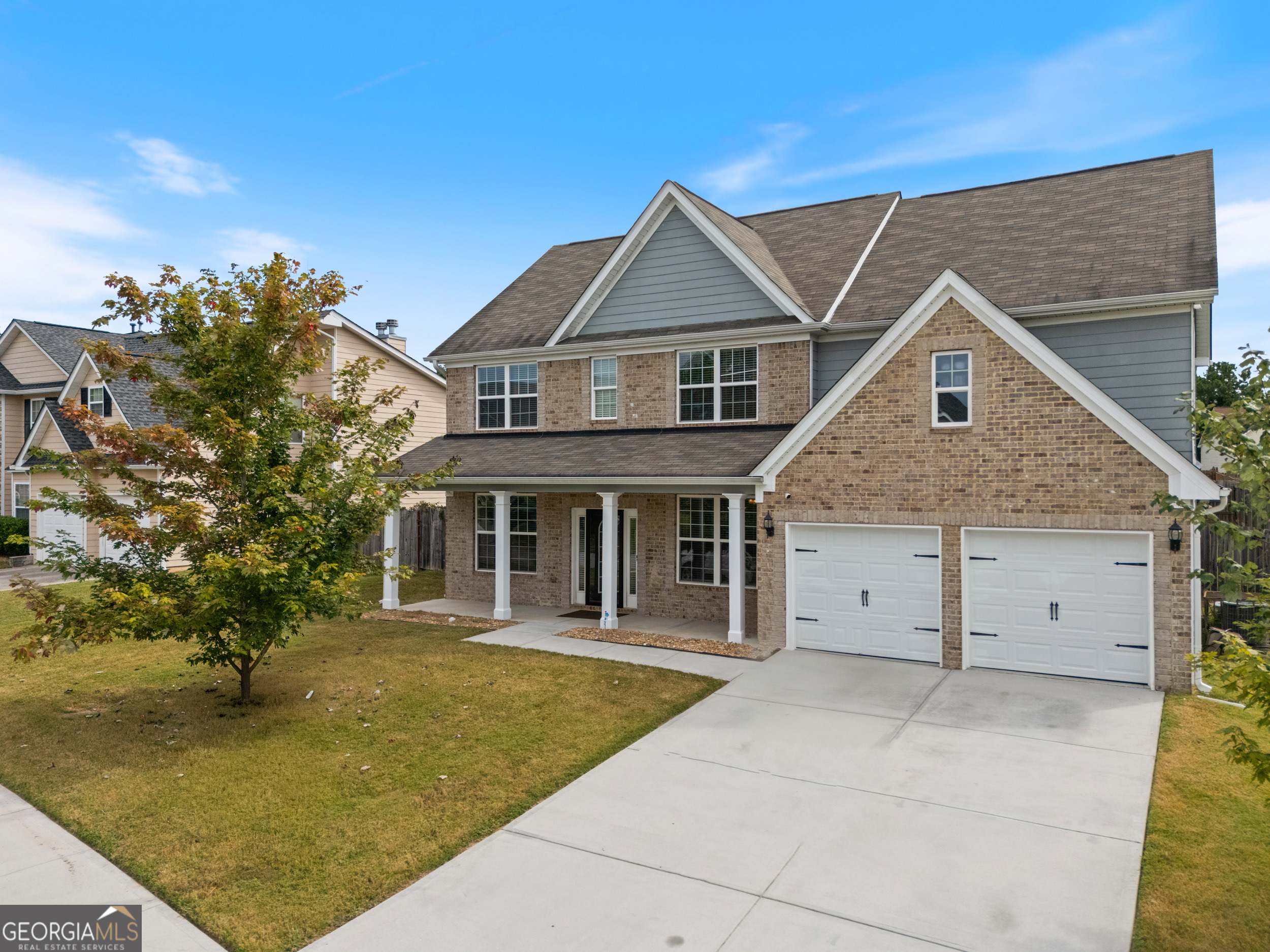 Welcome to this pristine 4-bedroom, 3-bathroom home, offering 2,730 sq ft of finely crafted living space on a nearly a quarter-acre lot in desirable Fairburn. As you enter, you're greeted by gorgeous hardwood flooring, soaring 9-foot ceilings, and an inviting formal living and dining area - perfect for hosting gatherings. The heart of the home is the eat-in kitchen, featuring a center island, granite countertops, a tiled backsplash, white cabinetry, and a convenient breakfast area. A main-level bedroom offers flexibility-ideal for guests, a home office, or multigenerational living. Upstairs, unwind in the luxurious owner's suite complete with a sitting area, dual vanities, separate shower, soaking tub, and walk-in closet. The second level also includes three additional bedrooms, a full bath, and a bonus loft area designed for entertainment or cozy family moments. Step outside to your private backyard-perfect for grilling, gardening, or relaxing under the stars. Located in a welcoming swim-and-tennis community with low HOA fees (only $39/month), this home offers both comfort and lifestyle value. Built in 2017 and in move-in-ready condition, this exceptional property is close to major commuter routes, shopping, dining, and excellent schools like Renaissance Elementary/Middle and Langston Hughes High. Don't miss the chance to make 7107 Suffolk Lane your next chapter.