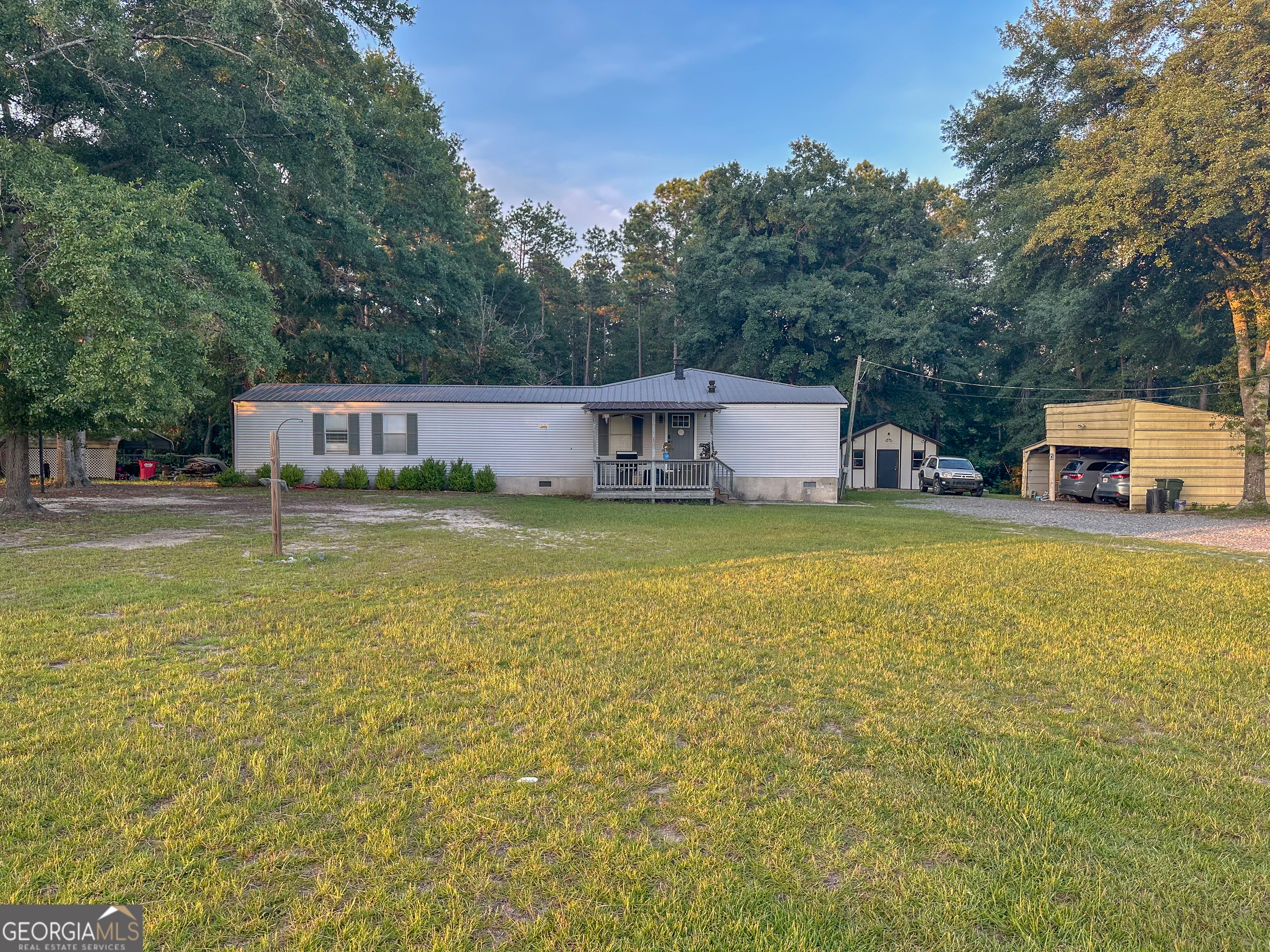 Updated & Move-In Ready on 2.4 Acres in Jones County! This beautifully maintained home combines thoughtful updates with a peaceful, spacious setting. Inside, the remodeled kitchen maximizes space and functionality with new LVP flooring, countertops, cabinetry, gas range, sink, and a stunning wood-plank accent wall framing the window that overlooks the new composite deck-perfect for morning coffee or evening grill and chill time. The split-bedroom floor plan features a spacious primary suite with a tiled shower, walk-in closet, and new dual vanity, mirrors, and fixtures. A 25' x 30' addition adds two large guest bedrooms with generous closets. The living room makes a great first impression with its stackstone fireplace, fresh paint, new LVP flooring, and welcoming entry through new fiberglass exterior doors. Just off the living room, you'll find an office that could serve as a 4th bedroom. Additional features include an HVAC system only 5 years old, a detached carport wired with a smart switch, a smaller fenced area for pets with a lean-to shelter. The 2.4-acre lot offers plenty of room to roam, garden, or simply enjoy country living. Whether you're looking for a move-in ready home or a solid investment, this property delivers!