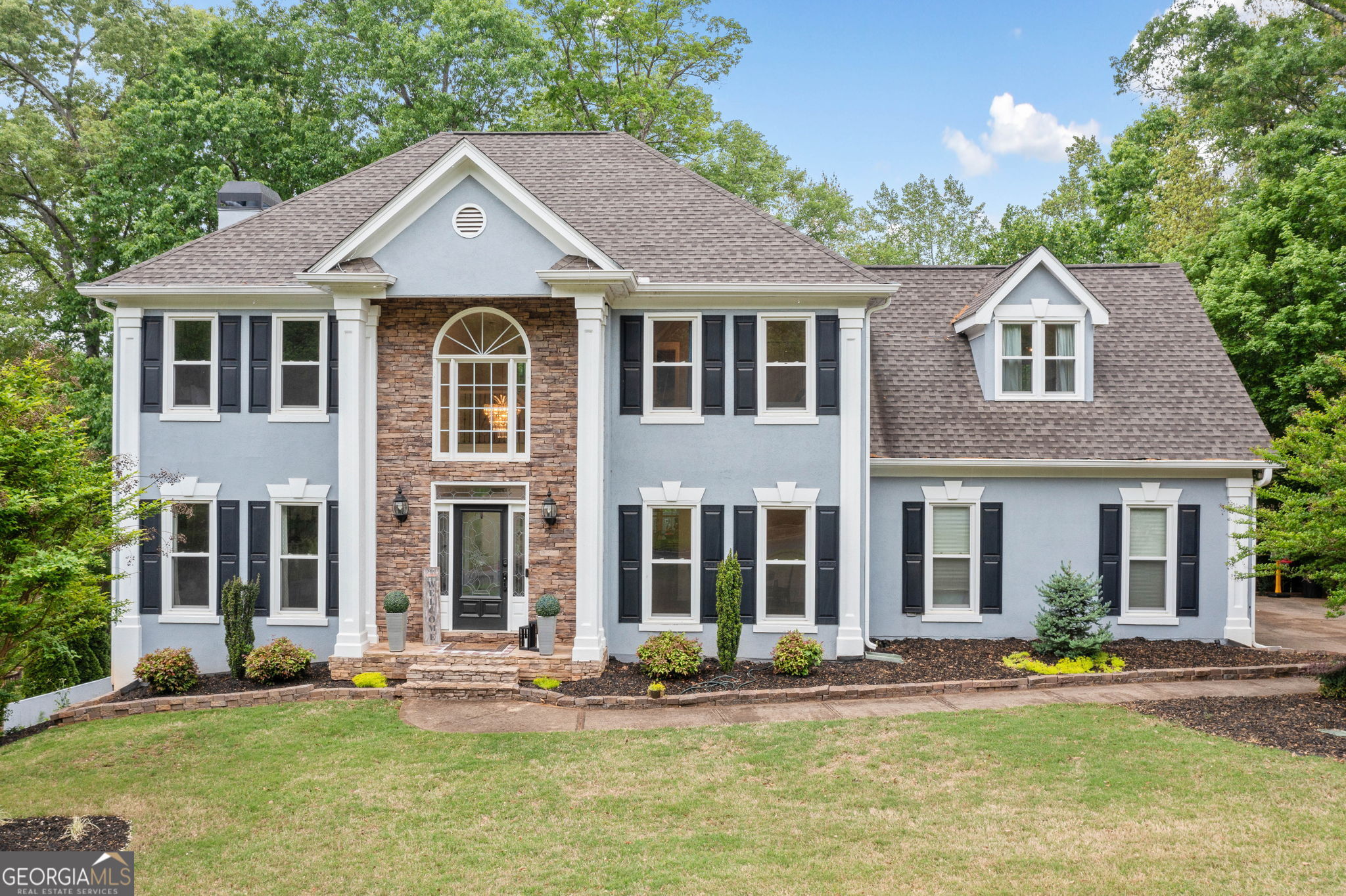 Welcome to your dream home in the highly sought-after Bradshaw Farm community! This expansive 6-bedroom, 3.5-bathroom residence is perfectly situated on a large, private lot, offering the space and comfort your family deserves. Step into the grand two-story foyer and instantly feel the elegance and warmth this home provides. The oversized kitchen is perfect for entertaining, featuring ample cabinetry, a center island, and a breakfast area that opens to the family room-ideal for gatherings and everyday living. The upper level primary suite offers a spacious retreat with a well-appointed bathroom including double vanities, a soaking tub, and a separate shower. Upstairs, you'll find generously sized secondary bedrooms and versatile bonus spaces-perfect for home offices, playrooms, or guest suites. The full finished basement is great for extra space or for multi-generational families. The backyard offers great potential with mature trees providing privacy. With a few trees thoughtfully removed, you could enjoy breathtaking views of the golf course just beyond your property line-truly the best of both worlds: privacy and scenery. Enjoy all the amenities Bradshaw Farm is known for, including golf, tennis, swimming, and a vibrant community atmosphere. This is more than a home-it's a lifestyle.