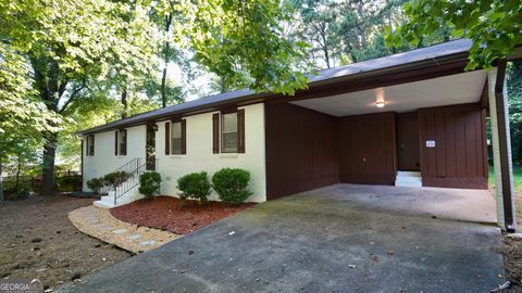 Photo of 5521 E Wind Drive SW, Lilburn, GA 30047 (MLS # 10591268)