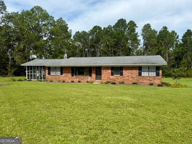 Charming Brick Ranch with Modern Updates on a Spacious Lot Welcome to this beautifully updated 3-bedroom, 2-bath brick ranch nestled on a peaceful, oversized lot with mature trees and plenty of room to roam. This home combines timeless charm with tasteful modern upgrades, making it truly move-in ready. Inside, you'll love the bright and open kitchen, featuring new white shaker cabinets, marble-style countertops, brushed gold fixtures, and designer lighting. The large windows invite in natural light and offer views of the expansive backyard. Enjoy the outdoors year-round with both a screened-in porch and an open deck-perfect for entertaining, dining, or simply relaxing in the fresh air. The property's generous yard provides space for gardening, play, or future additions. Additional highlights include: Classic brick exterior with fresh landscaping Updated flooring and fixtures throughout Spacious living areas with abundant natural light Peaceful setting surrounded by trees for added privacy This home offers the perfect blend of comfort, style, and outdoor living-all while being conveniently located near local amenities. Call today to make this house your home!