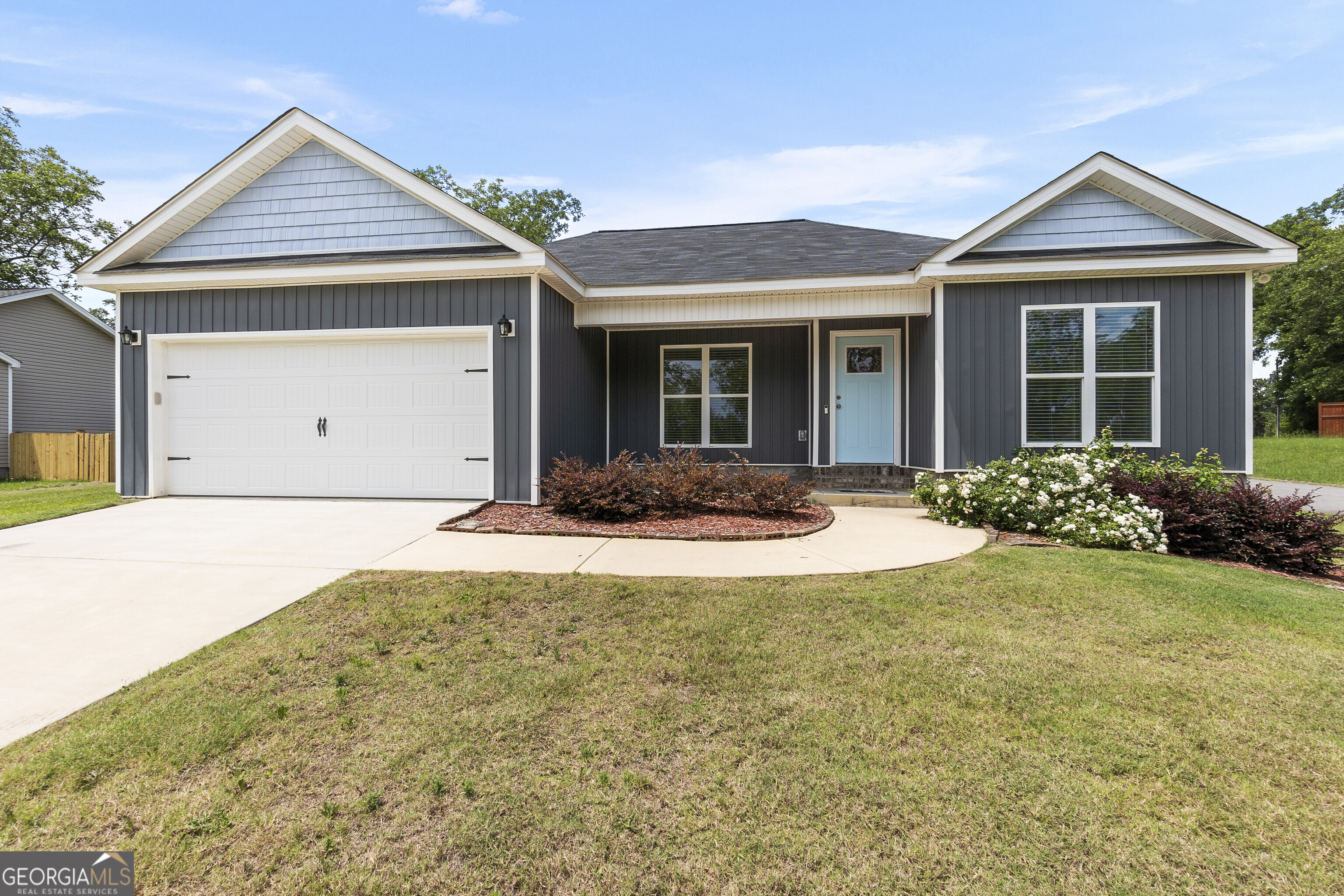 Welcome home to this charming one-story residence located in the heart of Cochran, GA! This 3-bedroom, 2-bath home features updated fixtures throughout and a bright, open layout filled with natural light. The eat-in kitchen offers plenty of space for casual dining, and the entire home is finished with durable laminate flooring-no carpet in sight! Enjoy your morning coffee on the covered front porch and relax or entertain on the covered back patio overlooking the fully fenced backyard. Don't miss out on this move-in ready gem with great curb appeal and modern touches!