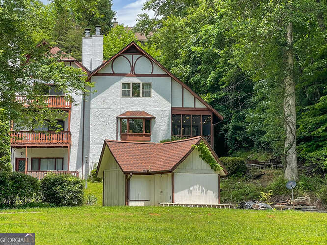 Welcome to your dream retreat in the heart of Helen! This stunning 3-bedroom, 3.5-bath condominium offers the perfect blend of comfort, style, and convenience-just steps away from downtown and all the charm this Bavarian-inspired town has to offer. Enjoy peace of mind with numerous recent upgrades, including: brand new ceiling fans and LED lighting throughout, fresh interior paint for a bright, modern feel, stylish new countertops and updated finishes, upgraded electrical throughout the home, 1-year-old water heater. Nestled right on the river, this home delivers serene views and the relaxing sound of flowing water from your sunroom. Whether you're looking for a full-time residence, a vacation getaway, or a rental investment, this property checks all the boxes. Location, updates, and unbeatable riverfront living-this gem won't last long! Schedule your showing today!