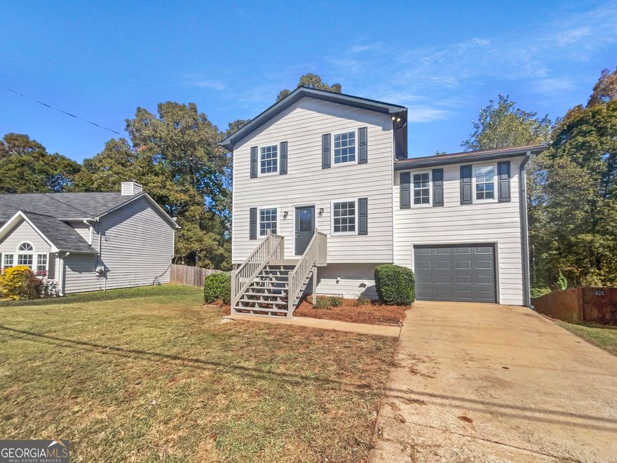 Welcome home to this charming 3-bedroom, 2-bath multi-level home in sought-after Canton, GA! The bright kitchen features white cabinets and an eat-in area that opens to a spacious deck-perfect for unwinding or entertaining. Enjoy cozy evenings by the fireplace in the inviting living room located just off the kitchen. Upstairs, you'll find all bedrooms and the laundry room for added convenience. Ideally located near I-575, shopping, dining, and everything the area has to offer. Don't wait-this one won't last!