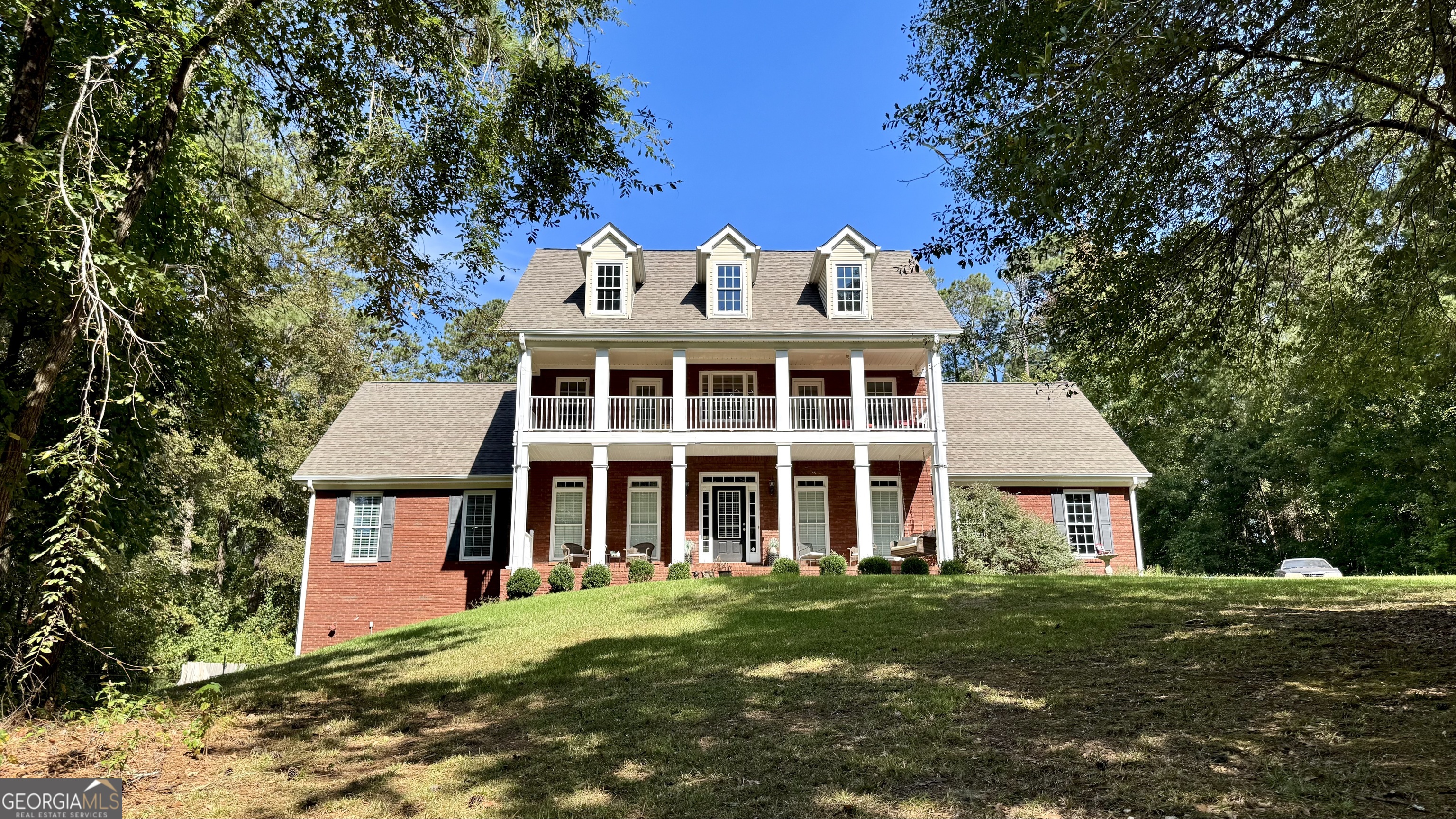 Discover your dream home in the highly sought-after Loganville High School cluster district! This stunning brick twostory home sits on a sprawling 2-acre lot and boasts a full basement and an inviting swimming pool. From the welcoming rocking chair front porch to the elegant interiors, this 4-bedroom, 3.5-bath residence is designed for both comfort and sophistication. Step inside to a grand two-story foyer with gleaming hardwood floors that flow into the formal dining room. The spacious great room features a cozy stacked stone fireplace, perfect for gatherings. The bright, open eat-in kitchen is a chef's delight, offering stained cabinets, a tiled backsplash, gorgeous countertops, and a convenient pantry. Retreat to the main-level master suite with a trey ceiling, two large closets, and a spa-like ensuite complete with double vanities, a garden tub, a separate tiled shower, and tile flooring. Upstairs, you'll find three additional bedrooms, two full baths, and a versatile office or bonus room. The full, unfinished basement provides endless possibilities for customization. Outside, enjoy the fenced backyard oasis, ideal for entertaining or relaxing by the pool. The large front and back yards offer ample space for outdoor activities. We VALUE & Welcome Buyer agents, please use Parkway Law Group as preferred closing attorney.