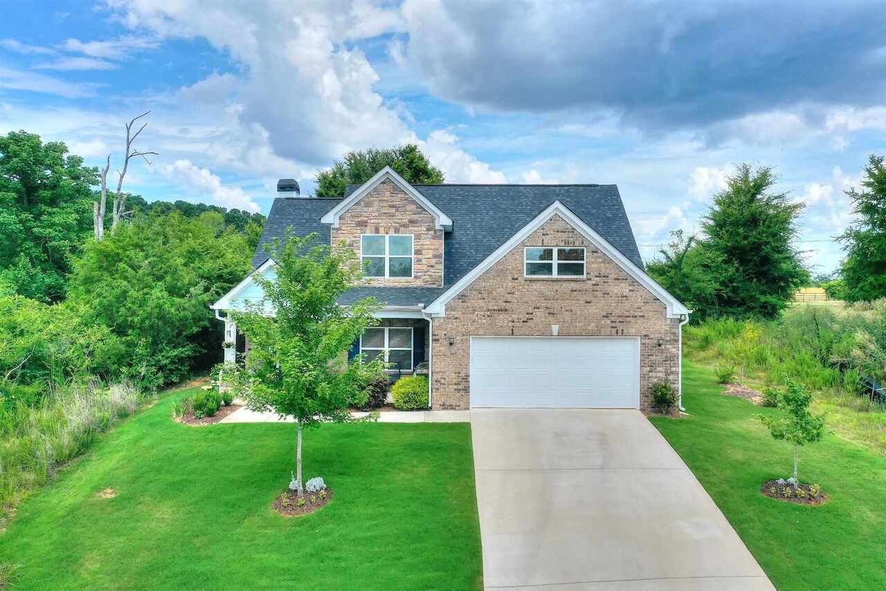 Back on the market due to no fault of seller, this home, built in 2018, in desirable Covington Place subdivision, is a dream. It has an open floor concept, neutral colors and hardwoods throughout the main living area. The kitchen has SS appliances, beautiful cabinetry and granite counters, already in place, so it's move-in ready. A spacious owners suite is on the main floor, with a tiled bath, double vanities and walk-in closet. Upstairs are 2 more large bedrooms, a huge bonus room and full bath. To top it all off, the yard is beautifully landscaped and fenced, with a covered patio. Come quickly and fall in love!