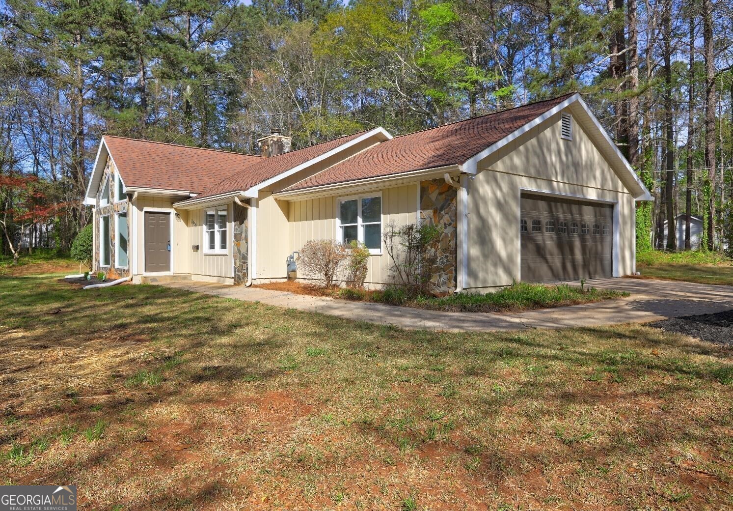 Welcome Home! This beautifully maintained turnkey 3-bedroom, 2-bathroom ranch-style home sits on a generous 1.18-acre corner lot in the highly sought-after Fairburn community. Step inside to discover a home full of character-vaulted ceilings, large windows, and an eye-catching fireplace that serves as the centerpiece of the great room, creating a warm and inviting space perfect for relaxing or entertaining. Natural light cascades throughout the home, enhancing the spacious, open feel of each room. Enjoy the convenience of being just minutes from Publix, Starbucks, Chick-fil-A, and other popular stores and restaurants. Whether you're a first-time homebuyer or a family looking for comfortable, single-level living on a large lot, this home has it all. Don't miss your chance to make this stunning Fairburn property your new home!