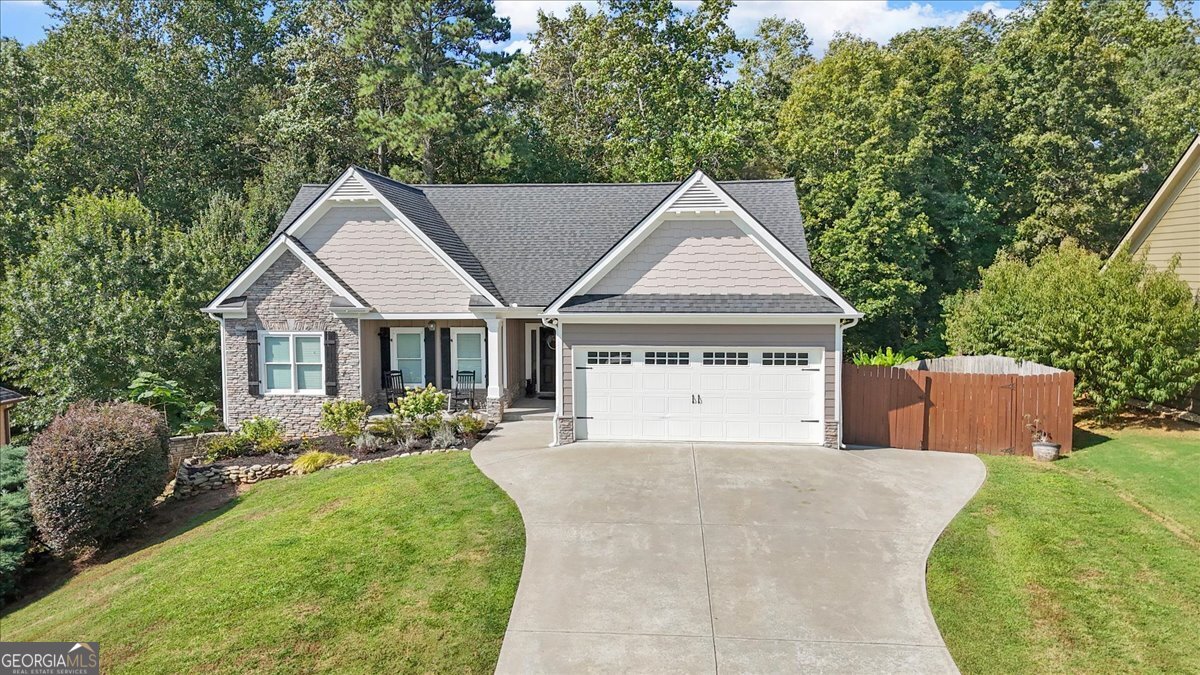 Welcome to this beautifully updated and spacious home at 421 Tom Avery Dr in Ball Ground, GA. This 4-bedroom, 3-bathroom residence offers a generous 1,677 square feet of living space, thoughtfully designed for comfort and modern living. Step inside to a fresh and inviting atmosphere, enhanced by a full interior paint job in 2023. The heart of the home, the kitchen, has been completely revitalized with a full suite of new stainless steel appliances, including a microwave, stove, refrigerator, and dishwasher. Enjoy year-round comfort with two separate, high-efficiency HVAC systems. The main level has its own dedicated indoor/outdoor HVAC unit, and the partially finished basement has a separate full indoor/outdoor system, ensuring perfect climate control throughout the entire home. The basement provides flexible space, ready for you to customize to your needs. Outside, the property is equally impressive. The exterior was professionally painted in 2022, and a new roof was installed in 2019, providing excellent curb appeal and peace of mind. A standout feature is the expansive new deck, built in 2020, an ideal spot for outdoor dining, entertaining guests, or simply unwinding in the fresh air. While a small project to transform a garage closet into an open closet was started-with only the initial cuts made to the drywall and door frame-the rest of the home is meticulously maintained and move-in ready. Don't miss your chance to own this fantastic property that blends style, comfort, and smart upgrades.