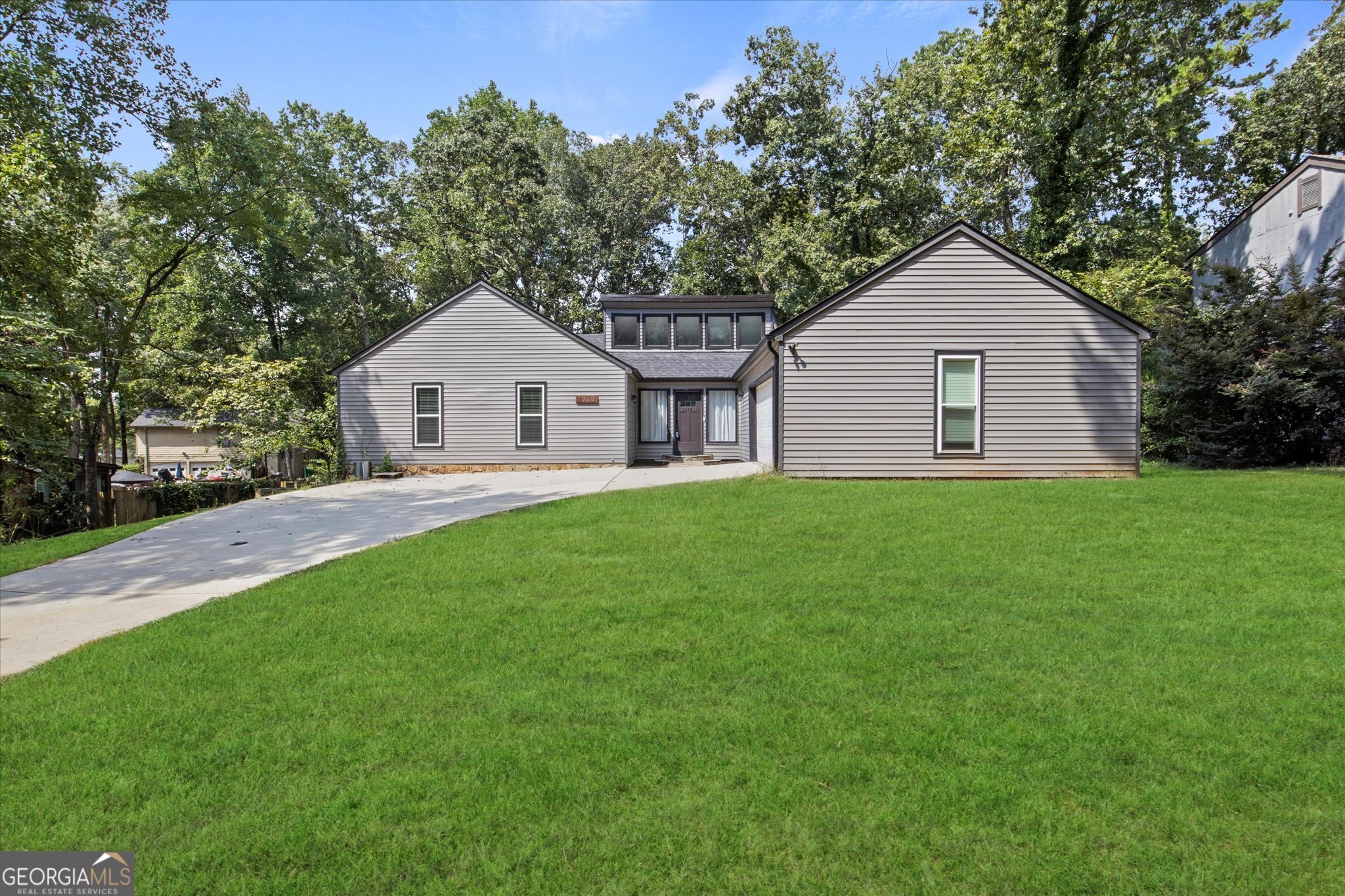 This 4BR/3BA home offers over 3,600 sq ft of spacious living with a new HVAC system. The open-concept kitchen with peninsula island flows into a cathedral-ceiling family room featuring a cozy fireplace. The primary suite includes a walk-in closet and a spa-style bath for a touch of luxury. A finished basement with private entry is perfect for an in-law suite, rental, or entertainment space. Set on a generous lot with a 2-car garage and no rental restrictions, this home is a fantastic choice for families or investors alike!