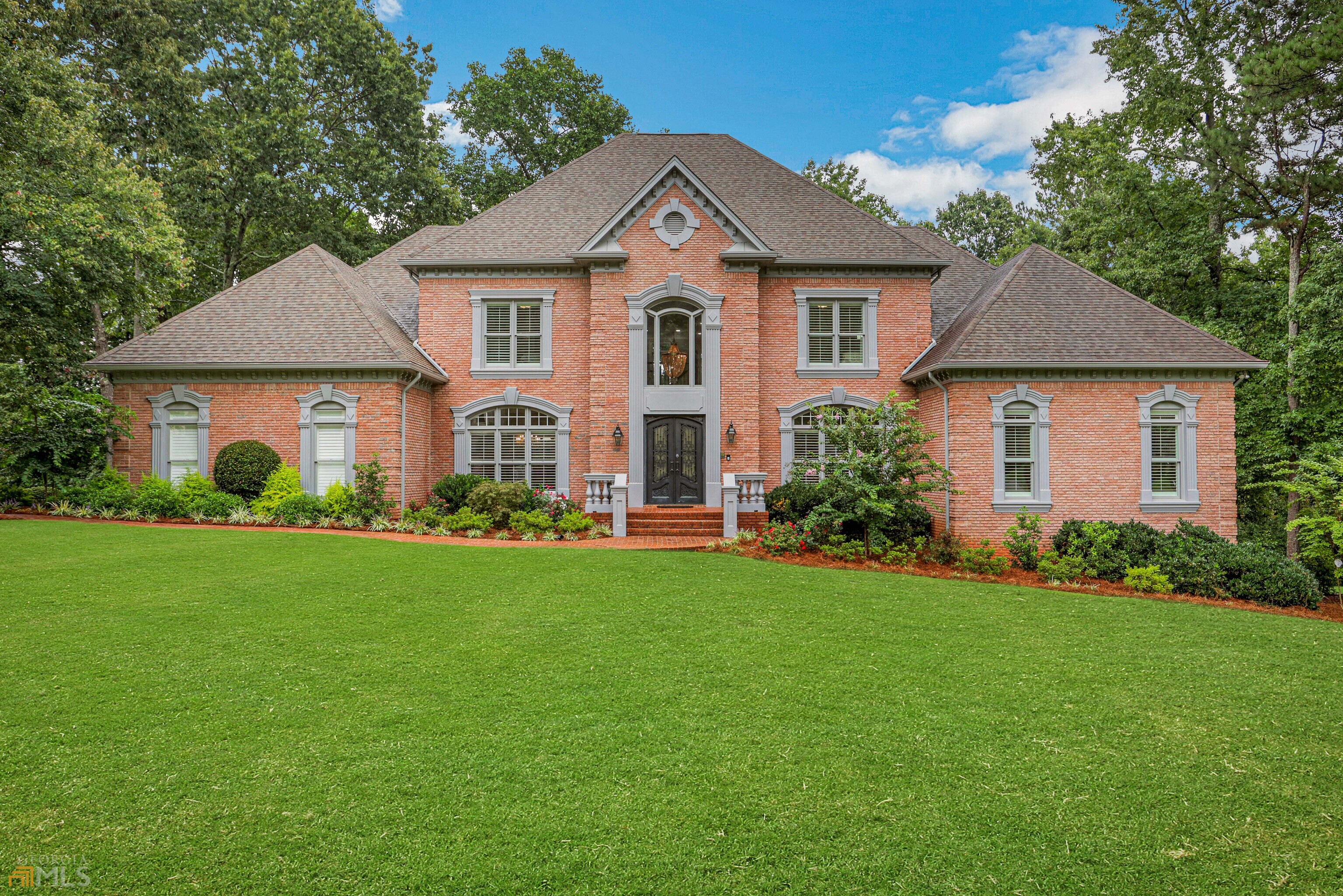 Nestled in one of Smoke Riseas most coveted subdivisions, this custom 4-sided brick home is nothing less than exceptional. The four exterior iron doors, Brazilian cherry wood deck and carefully planned exterior lighting are simply the start. The renovated kitchen is configured to meet the expectations of serious chefs. Every room in this home, including the seven bathrooms, has been renewed from floor to ceiling. The extensive, timeless millwork and high tray ceilings provide that perfect touch of elegance. To establish serenity within the vast owner's suite, the spacious laundry room is strategically located on the far side of the home. The gracious family room, living room, extravagant kitchen, dining room, foyer, and two half baths rest on the main level. The upper level holds four additional en-suites with walk-in closets. Composed of elements for both entertaining and relaxing, the finished terrace level contains a second family room/theater, an exercise room, sauna, full bath, game room, wet bar, ice maker, refrigerator, and access to one of the two outdoor living spaces. It is additionally outfitted with an office, a perfect place to work from home. There also exists a 21.4ax 43.9a unfinished room. This practical area features natural light, a garage door with an opener, and a sprinkler system. It is ideal for a workshop, music or art studio, fabrication facility, full gym, garage and/or storage. Both physical and invisible fencing line the property's professionally landscaped outdoor spaces. The lot provides privacy for the lower patio, upper deck, and a pool, if desired. Recently renewed and installed products include fresh exterior and interior paint, multiple large windows, recessed LED lights, foam insulation, rear septic lines, front septic pipes, and three A/C units that are under five years of age- one of which will be replaced in September 2022. The home is truly move-in ready. Schedule a tour soon.