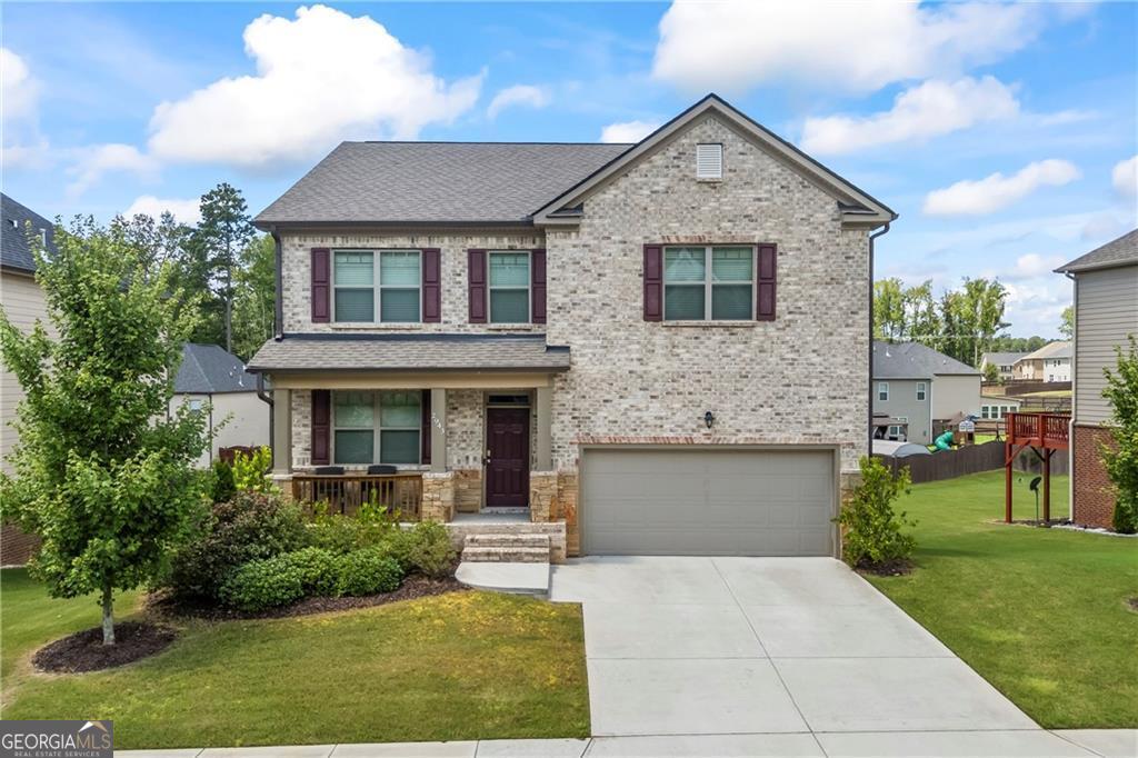 Welcome to this beautifully maintained home located in one of Gwinnett County's most sought-after neighborhoods-part of the highly acclaimed Grayson High School cluster. This spacious residence offers four generously sized bedrooms, three and a half bathrooms, and an interior that feels practically brand new. As you approach, you're greeted by a charming front porch perfect for morning coffee or evening relaxation. Step inside to light-colored luxury vinyl plank flooring that flows seamlessly throughout the main level. A flex room and formal dining area offer versatile spaces ideal for a home office, library, or playroom. The open-concept kitchen is a chef's dream, featuring granite countertops, tall cabinetry for ample storage, and a walk-in pantry that keeps your appliances organized without sacrificing counter space. The kitchen overlooks the spacious family room and dining area, complete with floor-to-ceiling custom accents and a cozy fireplace-perfect for entertaining or relaxing nights in. Upstairs, you'll find four spacious bedrooms and a large loft that can easily serve as a media room or secondary living space-the possibilities are endless. The home also sits on a sizable, level lot with a private, fully fenced backyard-ideal for children, pets, or weekend gatherings. Plus, the full unfinished basement offers incredible storage and future expansion potential. The community itself is a standout. Enjoy direct access to Bay Creek Park-one of Gwinnett's top-rated parks-via scenic walking trails. Neighborhood amenities include a resort-style pool with splash pad, poolside cabanas, built-in grills, a custom fireplace, tennis courts, green space, and a covered pavilion perfect for events and gatherings. And just at the entrance of the community, you'll find a brand-new Truett's Chick-fil-A-offering unmatched convenience for quick and delicious meals. With top-rated schools, nearby shopping, grocery stores, and a variety of great restaurants, this home offers an unbeatable combination of comfort, location, and lifestyle. Don't miss the chance to make this exceptional home yours-schedule your private tour today! More professional photos to come in a couple of days.