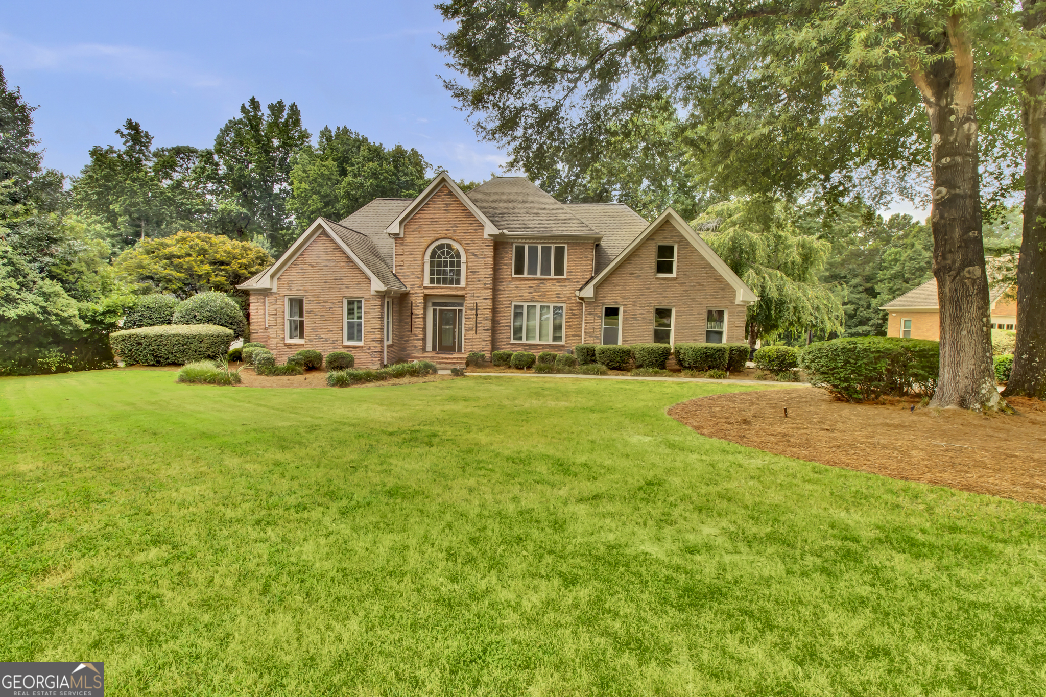Just Listed! Entertainer's Dream on Over an Acre Welcome home to this stunning, fully renovated 5-bedroom, 4.5-bath estate on a private, beautifully landscaped lot. With 3 sides brick, over an acre of land, and an impressive 4-car garage, this home combines classic elegance with modern upgrades for luxurious, functional living. Step inside to find hardwood floors throughout, a spacious open-concept layout, and abundant natural light. The gourmet kitchen features stainless steel appliances, granite countertops, and an eat-in breakfast area that opens seamlessly to the expansive deck-perfect for entertaining. The main-level owner's suite is a true retreat with an oversized jacuzzi tub, separate shower, and dual vanities. Multiple living spaces include a huge living room, cozy family rooms, and both front and rear staircases for added convenience. Enjoy year-round relaxation in the enclosed patios on both the main and basement levels. The daylight basement is ideal for multigenerational living, featuring a private entrance, fireplace, in-law suite, and its own 2-car garage-offering both comfort and privacy. With ample storage, exceptional craftsmanship, and thoughtful design throughout, this home truly has it all. Don't miss your chance to own this entertainer's paradise!
