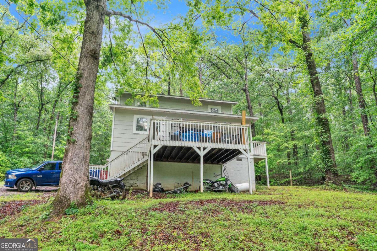 Tucked away in the peaceful countryside of Carrollton, this charming 3-bedroom, 2-bath home at 504 J C Daniell Rd offers the perfect blend of privacy and comfort. With 1,494 square feet of thoughtfully designed living space, this home features a bright, open floor plan, spacious bedrooms, and a cozy, welcoming atmosphere. Enjoy your mornings on the large front deck surrounded by nature, or unwind in the quiet of your wooded lot. Whether you're looking for a quiet retreat or a place to put down roots, this property delivers serenity just minutes from town conveniences. Don't miss this slice of Georgia charm!