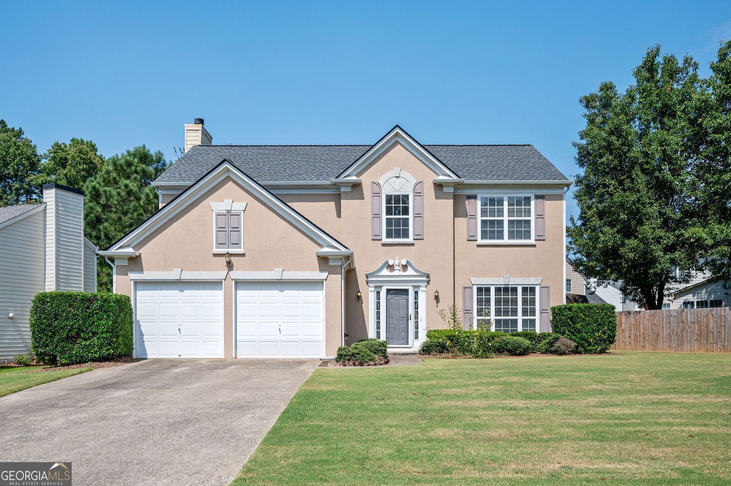 Welcome to this charming two-story home featuring a grand two-story foyer and a bright, open floor plan. The spacious family room boasts a cozy gas fireplace and flows seamlessly into the eat-in kitchen, complete with a center island, white cabinetry, newer stainless steel appliances and new flooring. Enjoy formal gatherings in the separate dining room, which opens to a light-filled living room-perfect for entertaining guests. Upstairs, you'll find all bedrooms including the primary suite with a large walk-in closet. The primary bathroom offers a double vanity, garden tub, and separate shower. Convenient upstairs laundry room with washer and dryer included. Step outside to a private, fenced backyard with a wood privacy fence and a patio-ideal for outdoor relaxation or play. Located on a quiet cul-de-sac street in Chastain Glen, a swim/tennis/playground community with no rental restrictions. Just minutes to I-75 and I-575, Kennesaw State University, shopping, dining, and more! Don't miss this move-in ready home in an unbeatable location! Roof is 5 years old. Upstairs HVAC replaced July 2022.