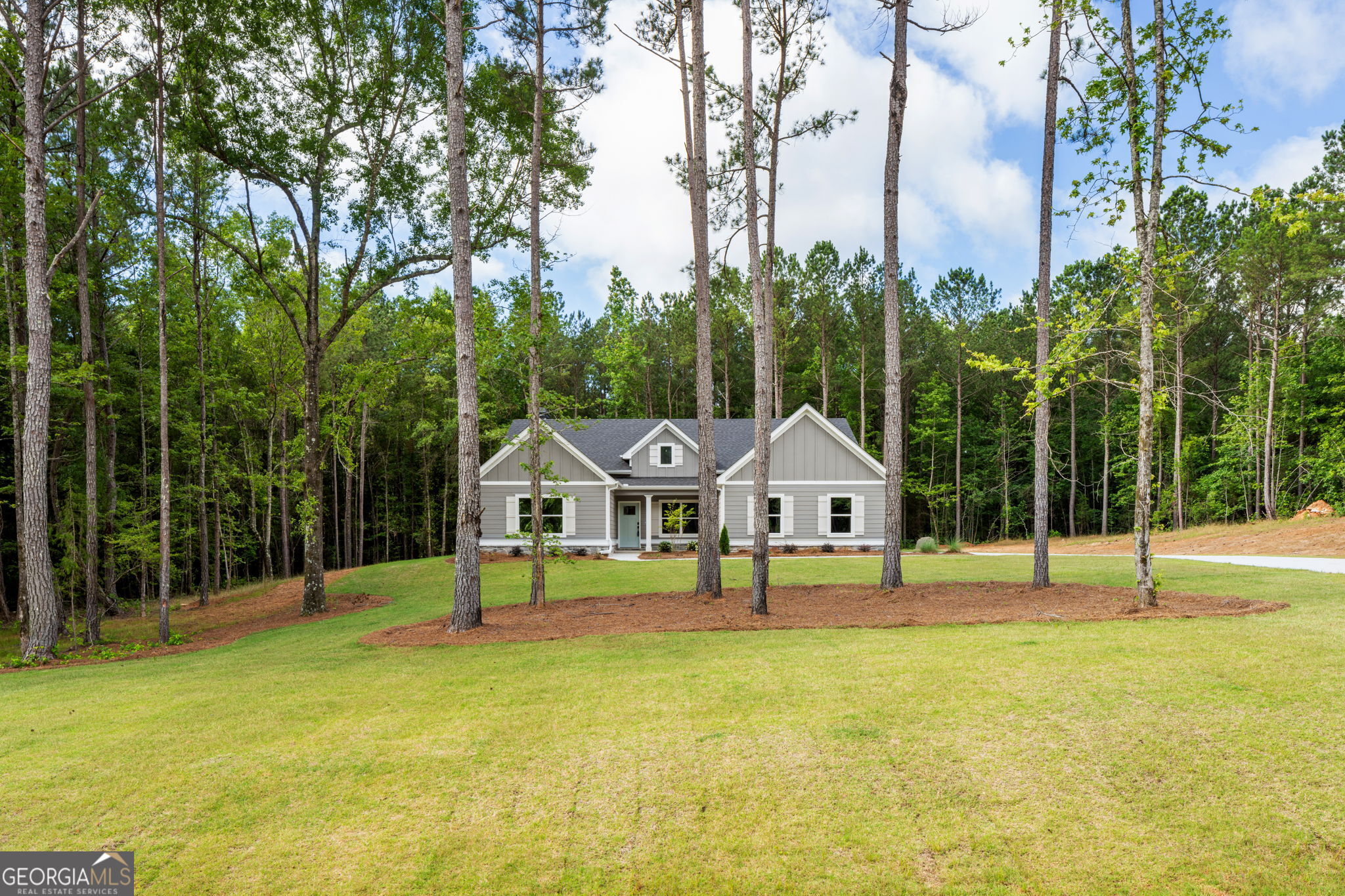 NEW CONSTRUCTION! MOVE IN READY! Welcome to "The Davenport" - one of our most popular single-level floor plans, now available on a sprawling 3+ acre wooded lot with fiber internet and no stairs! This beautifully designed home offers peaceful country living with all the modern upgrades. Step into the foyer and immediately notice the thoughtful design and attention to detail, including a formal dining room with a stylish trim accent. The open-concept kitchen features granite countertops, a designer tile backsplash, stainless steel appliances, a walk-in pantry, and a large island perfect for meal prep or casual dining. The spacious family room boasts a 10' ceiling and a cozy wood-burning fireplace with a stunning stone surround that reaches all the way to the ceiling - ideal for relaxing evenings at home. The luxurious owner's suite includes a serene sitting area, a generous walk-in closet, and a spa-like private bath complete with a freestanding soaking tub, tiled shower, and dual vanities. Three additional guest bedrooms share a well-appointed full bath with a tiled floor, granite countertop, and tub/shower combo. Enjoy outdoor living year-round on the large covered back patio, overlooking your private, wooded lot. Additional features include cement board siding, architectural shingles, Low-E windows, and energy-efficient spray foam insulation in the attic. Don't miss the smart home features: keyless deadbolt, select smart switches, video doorbell & more. Builder requires a 2% construction deposit and offers a $2,500 credit with use of a preferred lender - plus an additional $2,500 from the lender! Preferred lender information available in documents. Call, text or email for pre-sale opportunities or visit our website for more information!