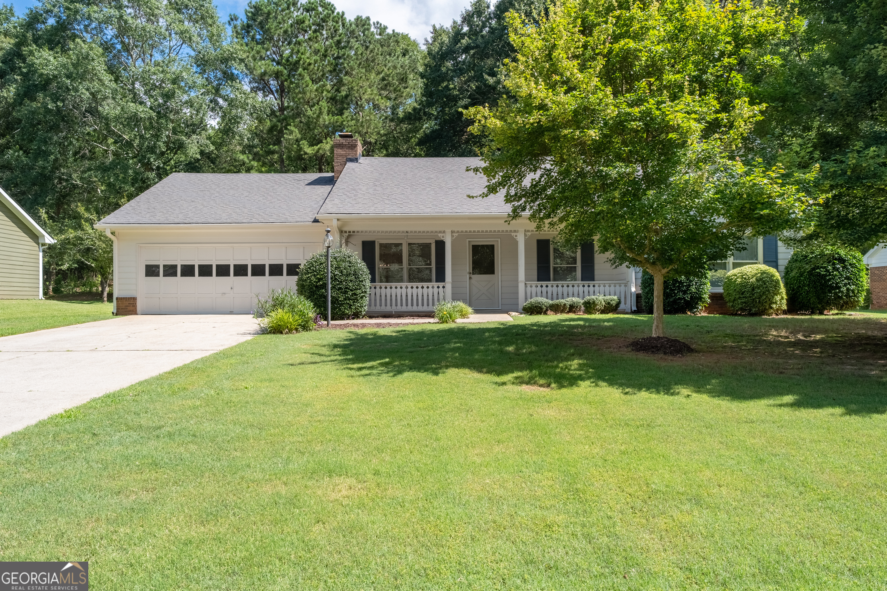 Make this charming one-level home your own!* NO STEPS adds to the ease of life!* Almost a half acre lot with grassy lawn and wooded buffer to the rear!* Level driveway!* This home has hard floors throughout living areas and BRAND NEW CARPET in the bedrooms!* Great room has a tray ceiling and gas log fireplace!* Large laundry room with window, washer and dryer stay!* The kitchen features white cabinets! Hand-made stained glass transom!* Window over the kitchen sink!* Primary bedroom includes a soaking tub with shower and walk-in closet! Two additional bedrooms and convenient hall bath!* All the walls are neutral and light, making decorating a breeze!* Wonderful covered rear patio! Bead-board ceiling and fan on a brick paver floor. There's even a designated spot for your grill!* Two car garage with auto-door opener, HUGE heated and cooled storage room!* This wonderful home is ready for a new owner to make it their own!!