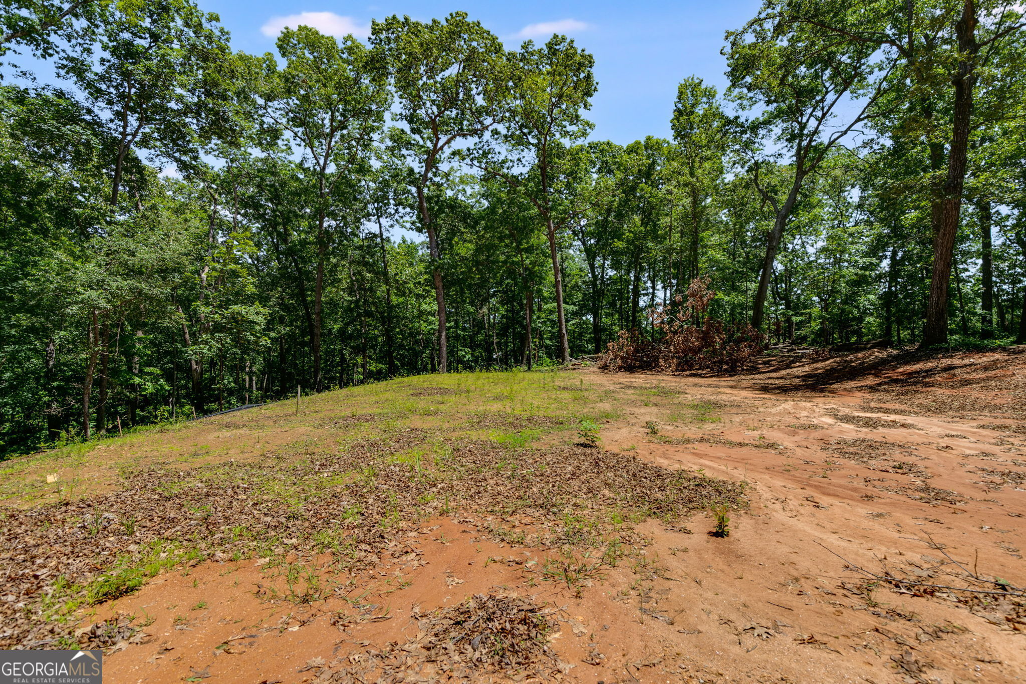 Great building lot! 11.2 acres! Gravel drive is already there along with a padded lot. Was originally a barndominium but seller has decided not to build. Per County there is water at the street buyer would need to submit application for approval. Over 500 ft of road frontage. This is going to make an amazing home site!