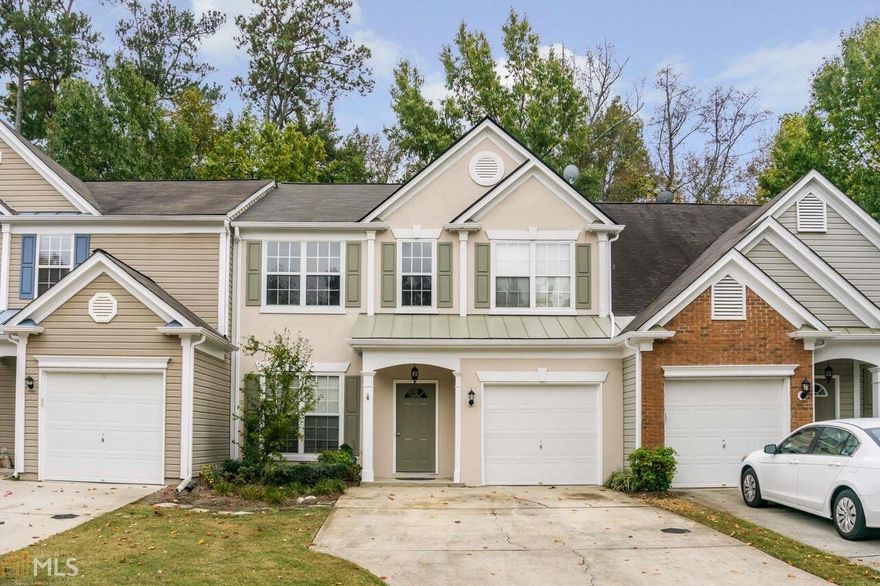 Renovated Townhome with garage in a community close to everything! New SS appliances, cabinets, flooring, tile back splash, granite ctops, carpet, and paint (inside and out). The front door has been replaced as well.