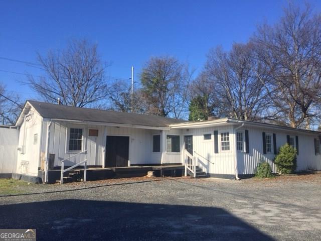 Fantastic opportunity for large commercial lot/ space in midtown. Great location for any automotive or service business such as painting contractor office/HVAC company. Location is key! Large space needs work. Tons of parking. Selling ''As-Is''. Owner related to listing agent. (Buyer to get their water connected)