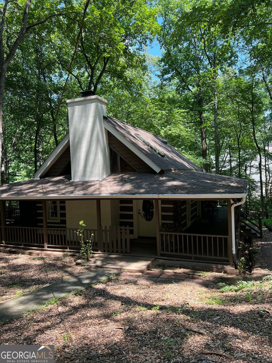 Welcome to 2071 Vicki Lane, Cumming, GA!  Charming 2-bedroom, 1-bath cabin on 5 private acres offering the perfect blend of rustic charm and modern comfort. This 2,055 sq. ft. home features a spacious open floor plan with natural wood accents, abundant natural light, and inviting living spaces.    Enjoy peaceful country living while being just minutes from GA-400, shopping centers, restaurants, parks, and top-rated schools. The property offers plenty of space for outdoor entertaining, gardening, or potential expansion.    Currently operating as a successful Airbnb, this home presents an excellent investment opportunity or the ideal private retreat. Whether you're looking for a weekend getaway, income-producing property, or a place to call home, this unique cabin has endless possibilities.    Don't miss this rare opportunity! Contact the listing agent today to schedule your private showing.