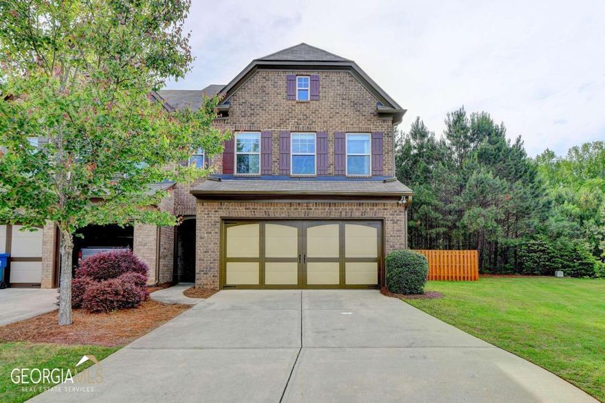 Fabulous NE Facing End Unit Townhome in The Sought after Swim/Tennis Community of Shiloh Woods. Thoughtfully Curated, this Home Features an Inviting Entry Foyer which Leads to The Light Filled Open Floorplan with Hardwoods Throughout the Main Level. The Gourmet Eat In Kitchen Features Granite Counter Tops, Stained Cabinetry, Stainless Appliances and Breakfast Bar which Overlooks The Expansive Family Room with Fireplace and Wall of Windows. Half Bath on Main. The Second Level Features an Open Flex Space which Makes for The Perfect Office/Exercise Area/Loft. The Master En Suite is a Private Oasis Featuring Sitting Area and Large Windows Framing The Surrounding Landscape. The Spa like Master Bath Offers a Haven for Relaxation, Complete with Soaking Tub, Walk in Shower and Double Vanities. Secondary Bedrooms are Spacious with Full Guest Bath. Laundry Room Upstairs with cabinets. The Gorgeous and Generously Sized Fenced in Backyard with Patio Sets This Home Apart and is The Perfect Place for Large Gatherings and Entertaining. Minutes to GA 400, Halycon, Avalon, Marketplace, Fowler Park and Big Creek Greenway. Exceptional Denmark School District It Does Not Get Better Than This! So, Come Home... The Good Life Awaits!