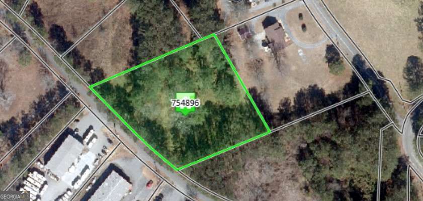 Prime investment opportunity in a growing area. Surrounded by ongoing commercial and residential development, this property offers excellent visibility and accessibility with immediate access to I-75 and Highway 92. Located just minutes from downtown Acworth, the site can be acquired along with an adjacent 1-acre parcel, totaling 3 acres - ideal for future development.