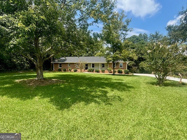 BRICK BEAUTY ON 2.6 ACRES COMPLETELY RENOVATED, NEW 30 YEAR ARCHITECTURAL ROOF, BRAND NEW 4TON HVAC SYSTEM AND ALL NEW CLEAN AIR DUCT, NEWLY POURED SIDEWALKS WELCOME FRONT DOOR AND BACK DOOR GUEST, COVERED FRONT & BACK PORCHES, GORGEOUS LIVING, DINING AND ENTERTAINING SPACE GATHERS AROUND A CUSTOM GRANITE ISLAND FOR EVERYDAY MEALS AND HOLIDAY ENTERTAINING, KITCHEN FEATURES ALL NEW WHITE CABINETRY WITH UPGRADED SOFT CLOSE DOORS AND DRAWERS, ALL NEW SS APPLIANCE PACKAGE, BUILT IN PANTRY, GRANITE COUNTER-TOPS, GORGEOUS BACKSPLASH, 2ND SEPARATE FAMILY ROOM/DEN WITH FIREPLACE, NEWLY INSTALLED OAK HARDWOOD FLOORS THROUGHOUT LIVING AND HALLWAY, NEW CARPET AND PAD IN BEDROOMS, ALL NEW INTERIOR PAINT AND UPGRADED 5" BASE, ALL NEW LIGHTING, ALL NEW PLUMBING, MASTER BEDROOM FEATURES DOUBLE VANITY, LINEN CLOSET, AND NEW TILE SHOWER, GENEROUS SECONDARY BEDROOMS, UPSTAIRS IS YOUR 4TH BEDROOM OR HOME OFFICE SPACE, EXTENDED LAUNDRY ROOM WITH BUILT IN BUTCHER BLOCK FOLDING TABLE (YOU'LL NEVER MIND DOING LAUNDRY AGAIN), QUIET COUNTRY LIVING AT ITS BEST. #THISISHOME ,