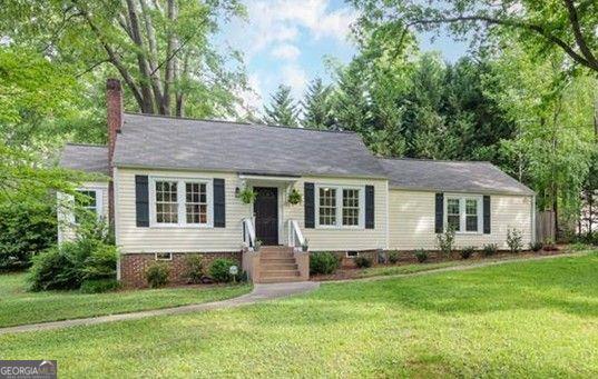 ***OPEN HOUSE SUN 2-4PM*** Charming 1940's Cottage, Renovated & Expanded. Flooded with natural light, this beautifully updated 3-bedroom/2-bath cottage sits on a spacious, level corner lot just steps from Pendergrast Park. Inside, you'll find a welcoming family room with a cozy fireplace, hardwood floors, and a graceful arched opening that leads into the dining room. The dining area flows seamlessly into the renovated kitchen, featuring granite countertops, a tile backsplash, breakfast bar, and newer appliances. A wall removal created an open-concept feel, while an adjacent sunroom with new flooring provides the perfect spot for a home office or sitting area. The primary suite addition is a true retreat, boasting vaulted ceilings, French doors opening onto a large brick patio, a spacious walk-in closet, and a spa-inspired bath with a custom vanity, tiled shower, and tile flooring. Two additional bedrooms share a newly updated bath, along with a new laundry room for convenience. Step outside to enjoy the expansive yard, complete with a brick patio, generous parking pad, and storage shed. Recent upgrades include: fresh paint, smooth ceilings, modern lighting, updated electrical panel, updated HVAC, water heater, plumbing, roof, and fixtures throughout. Hardwood flooring extends across the home, with carpet in the primary bedroom. Ideally located with easy access to I-85, Brookhaven, Buckhead, Emory, CDC, and downtown Atlanta. Lot can be subdivided into 2 buildable lots or bring your builder and raise the roof!
