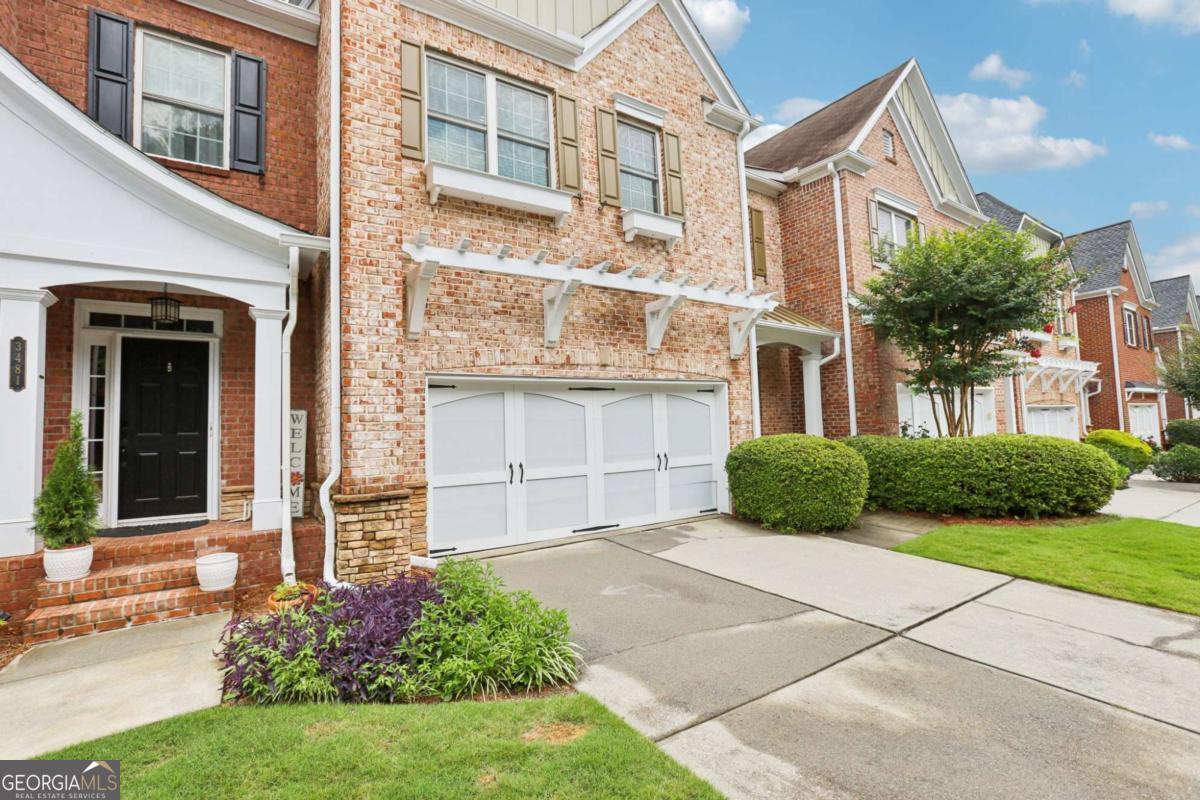 Discover elevated comfort and style in this elegant 4-bedroom, 4.5-bath townhome offering over 3,200 square feet of beautifully appointed living space in the prestigious gated community of Kedron Falls. This brick-front beauty welcomes you with rich hardwood floors, soaring ceilings, and an open-concept layout designed for effortless entertaining. The gourmet kitchen is a chef's dream, featuring granite countertops, a gas cooktop, stainless steel appliances, a breakfast bar, and abundant cabinetry. Retreat to the expansive master suite complete with a private balcony, spa-inspired bath, dual vanities, and a spacious walk-in closet. The fully finished basement offers a versatile bonus room, full bath, and flexible space-ideal for a guest suite, home office, or media room. Additional highlights include: Two-car garage Two private decks for outdoor enjoyment Upgraded lighting fixtures Meticulously landscaped grounds with HOA-covered maintenance Perfectly situated just minutes from The Forum, Historic Norcross, top-rated schools, shopping, dining, and major highways. Located within walking distance of Peachtree Elementary School (Pre-K to 5th grade) and in close proximity to Pinckneyville Middle School and Norcross High School. A rare find with endless possibilities-schedule your private tour today!