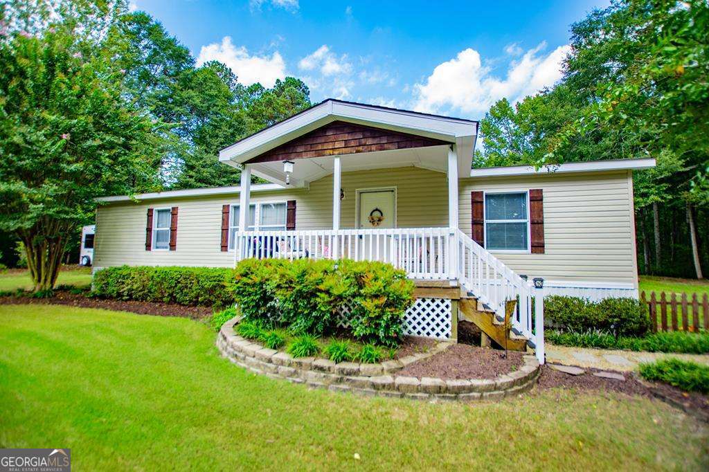 Welcome to peaceful country living in the sought-after Central School District! This 3 bedroom, 2 bath modular home is perfectly situated on 5 beautiful acres, offering both privacy and room to grow. A large metal building adds incredible versatility perfect for a workshop, storage, hobbies, or small business use. With acreage to spread out and no HOA, the possibilities are endless. Whether you're looking for a homestead, a place for recreation, or simply a private retreat, this property checks all the boxes. Don't miss your chance to own acreage in Central Schools-schedule your showing today!