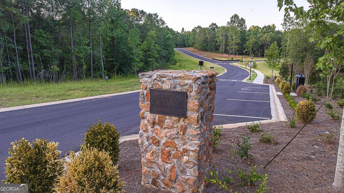 Largest Lot; Wide, Lower Lying, Level Topo; PE Right Side; Cul De Sac; Full Acreage is private (including storm water retention pond) Create the lifestyle and home of your dreams in Athens newest development, Spartan Manor! With an Athens address in Oconee County, this community offers unrivaled convenience with access to award winning schools. Exquisite homes will be built on lots ranging from 1.5-4.5 acres. Nestled amongst mature hardwoods and gently rolling hills, lots provide privacy and tranquility. Spartan Manor, where beauty and convenience come together to create a community that will captivate you! Reward yourself with the extraordinary lifestyle you deserve. Agent and buyer shall review covenants and design guidelines on Spartan Manor website; https://spartanmanorhomes.com/wp-content/uploads/2025/05/spartan_manor_design_guidelines_2025_05.pdf