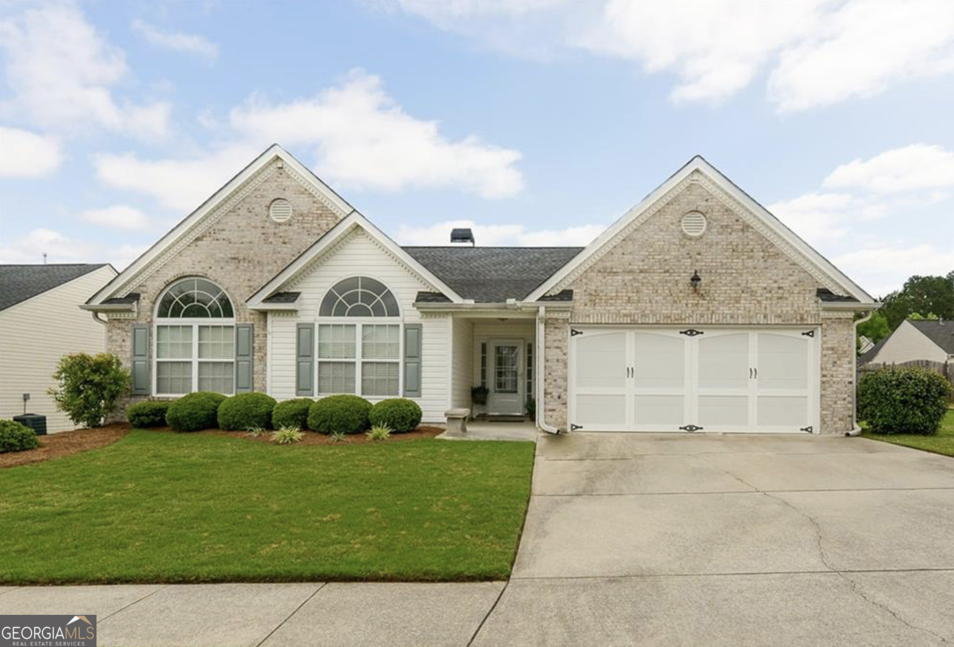Feels like home at The Overlook, a desirable swim/tennis community with playground, clubhouse, and Silver Comet trails. You will fall in love with this Ranch Garden home on a level lot with primary on main. This manicured and well-kept home boasts 10' ceilings and hardwoods throughout with wainscoting accents, trey ceilings and crown molding. Open floor plan with a large family room and stacked stone gas fireplace. Separate formal dining room. Chef's kitchen with island for entertaining and plenty of cabinets for storage. Oversized primary bedroom with a sitting room and cozy fireplace. Large primary bathroom has a double vanity, soaking tub and separate shower, his/hers closets and vanities. Home comes with the refrigerator, washer, dryer, and lawn mower. Enjoy your enclosed sunroom year-round! Level backyard with an outbuilding for lawn mower and tools. Close to schools, shopping, dining, and hospital. Look no further and come see your next home!