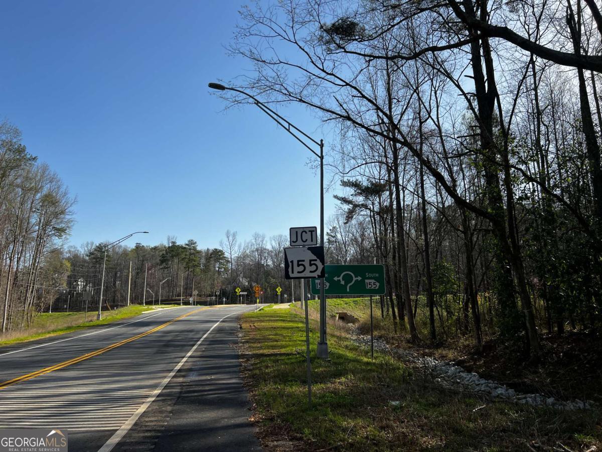 Seize this incredible opportunity to own 4.04 acres of prime land in Ellenwood, GA located at the highly visible corner of Highway 155 and Panola Road in Henry County. This expansive lot is ready for development, offering the perfect setting for a private estate, multi-home subdivision, or investment property. Ideal Location - Convenient access to I-675, I-75 and major roadways for easy commuting to Atlanta and surrounding areas. Residential Ready - Perfect for a custom home, family estate, or small residential development. Flat and Usable Land - Minimal Clearing Needed, making it an excellent build site. Nearby Amenities - Close to schools, shopping centers, dining, and recreation. Growing Area - Ellenwood is a rapidly developing community with increasing property values. Whether you're a homebuyer looking for a spacious private retreat or a developer searching for potential investment, this 4.04 acre corner lot offers endless possibilities.