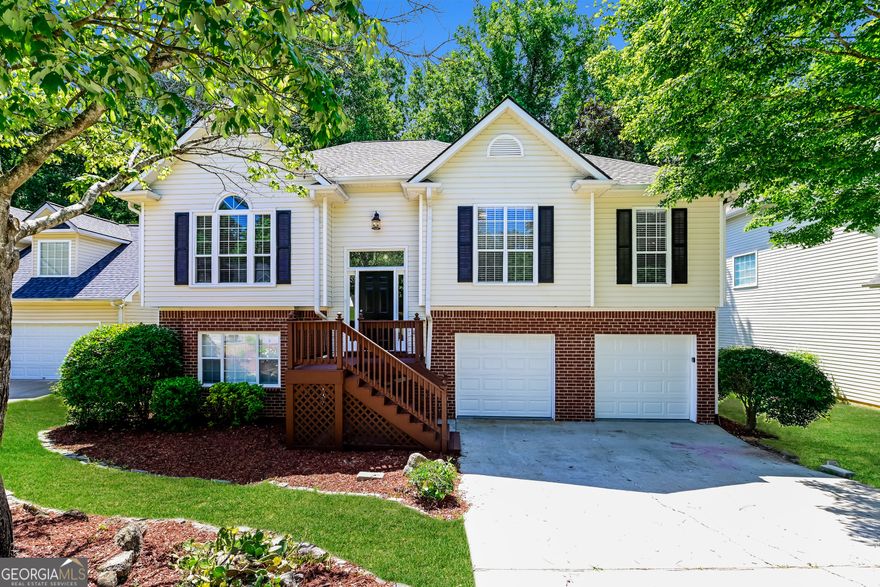 Lovely 5BR/3BA home in the heart of Peachtree City! Situated on a peaceful greenbelt lot close to shopping, dining, golf cart paths, and in the sought-after Starr's Mill school district. Fresh interior paint, vaulted ceilings, and LVP flooring throughout. Kitchen features SS appliances, breakfast bar, and dining area open to the living room with tile fireplace. Primary suite offers trey ceiling, walk-in closet, dual vanities, separate shower, and soaking tub. Finished terrace level includes 2 bedrooms, full bath, and large living area-perfect for guests, in-laws, or home office. Enjoy the fenced backyard with patio, deck, pergola, and stone walkway. Move-in ready and full of charm!