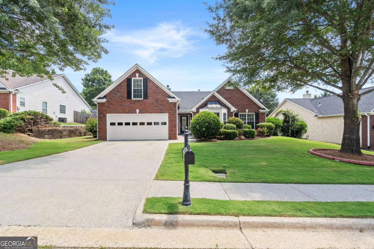 Welcome to 141 Carleton Gold Trail in Dacula-a beautifully maintained, move-in ready ranch-style home offering 4 bedrooms and 2.5 baths. This spacious, single-level property sits on a large, level lot with a private backyard perfect for entertaining, gardening, or relaxing. Inside, you'll find a light-filled open layout with fresh interior paint and updated flooring. The renovated kitchen features granite countertops, stainless steel appliances, modern backsplash, and generous cabinet space-ideal for everyday cooking and entertaining. The family room flows seamlessly from the kitchen, creating an inviting and functional living space. The oversized owner's suite includes a walk-in closet and an en-suite bath with double vanities, soaking tub, and separate shower. Secondary bedrooms are well-sized and offer flexibility for guests, office, or playroom. Additional upgrades made by the seller include newer HVAC, smart thermostat, updated lighting, custom blinds, freshly painted exterior trim, and improved landscaping for curb appeal. Conveniently located near parks, schools, shopping, and commuter routes, this home offers comfort, style, and easy access to everything Dacula and the greater Atlanta area has to offer.