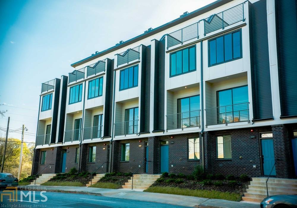 Panoramic skyline views from this modern masterpiece in the heart of Intown Atlanta! Just steps from Summerhill Commercial District, The Met, & the Atlanta Beltline THIS. IS. THE. ONE.??Saturated with natural light, this incomparable home boasts 4 floors of luxury living with 3 spacious bedrooms, 3 gorgeous baths, 2 half baths, separate office, & a private rooftop terrace! The first level features a home office with direct access to the garage, wired for electric car charging. Entertain guests in the open concept second level complete with a gourmet kitchen, large island, spacious dining, & brilliant living space. Retreat to the master suite with custom millwork, built-in closet, & spa-like bath. Or simply never leave the top floor fully equipped with wet bar, soaring 14 ft ceilings, &??matchless views of the greatest city from your rooftop deck! An incredible opportunity with limitless investment potential where you can WALK EVERYWHERE. Summerhill, Grant Park, The Beltline, Adair Park, The Met, Mercedes Benz Stadium, Phoenix Park, & South Downtown are all just steps outside your front door. Brilliant!