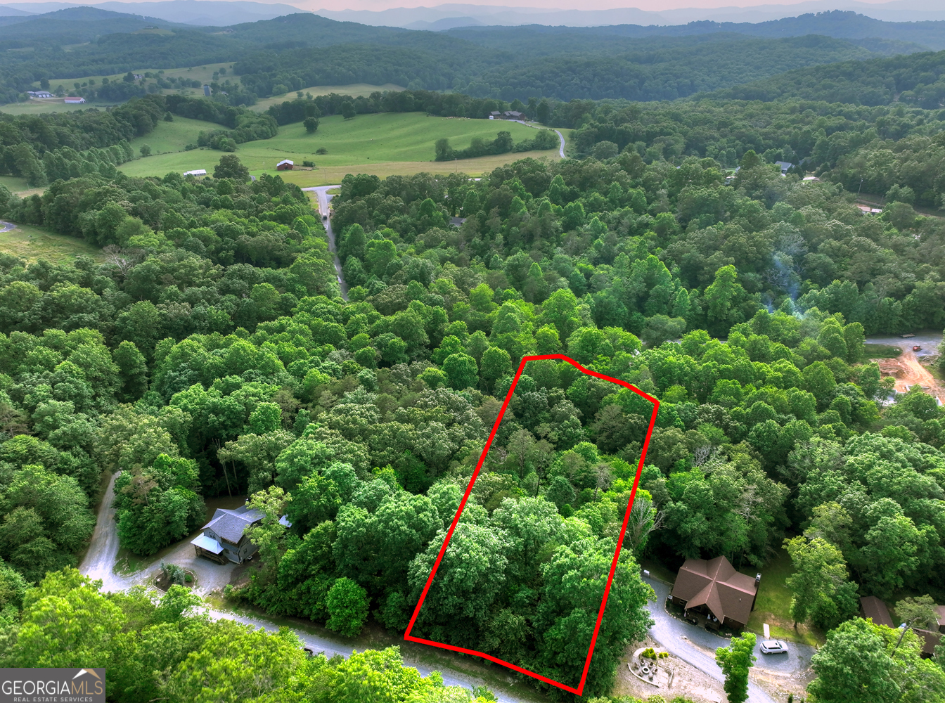 Discover the perfect opportunity to build your dream mountain retreat on this 1.11-acre parcel located on Winding Creek Rd in the heart of Blue Ridge, GA. This ready-to-build lot offers gently rolling topography that provides both character and flexibility for home design, whether you're envisioning a cozy cabin, modern retreat, or full-time residence. With electric and water already available, and only a septic system needed, the heavy lifting is already done-just bring your vision! Situated in one of Georgia's most desirable mountain towns, this lot is just a short drive from the vibrant downtown Blue Ridge area, known for its charming shops, craft breweries, farm-to-table dining, and scenic railway. Outdoor lovers will appreciate the close proximity to Lake Blue Ridge, the Toccoa River, and thousands of acres of Chattahoochee National Forest, offering endless options for hiking, fishing, boating, and exploring nature. Enjoy the perfect balance of seclusion and convenience-just 1 hour and 20 minutes from Chattanooga, TN and 1 hour and 45 minutes from Atlanta, GA. Whether you're looking to invest, build a vacation home, or create your forever escape, this property offers a rare combination of accessibility, privacy, and potential. Don't miss your chance to own a piece of North Georgia's thriving mountain community-this one won't last long!