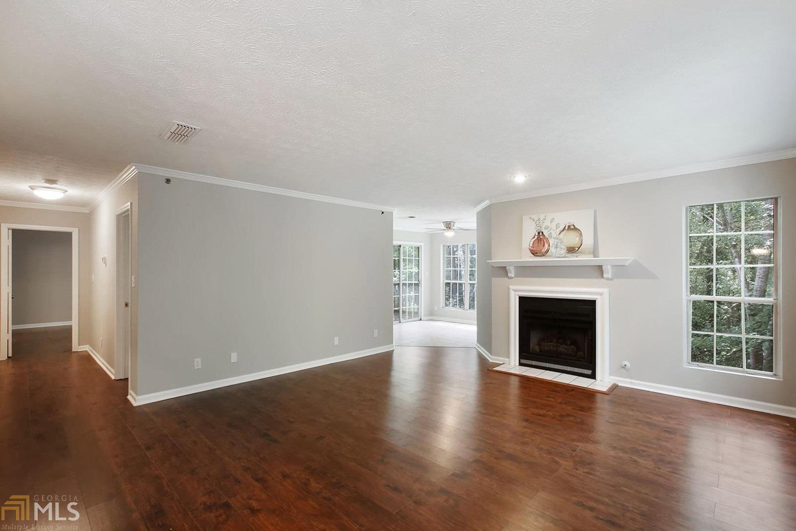 Smyrna/Vinings 2 Bedroom Condo w/New HVAC! Hardwoods Throughout! New Kitchen Granite Counters & Cabinets! SS Appliances Remain! Separate Dining, Living Room w/Tiled Fireplace opens to Tiled Sunroom! Sit and Sip on one of two covered decks with views of walking trails & pond! Master Suite: Walk In-Closet, New Granite Vanity, Tiled Shower/Floors, and Private Access to Covered Deck! Spacious Secondary Bedroom w/New Ceiling Fan! New Paint Throughout! Community Swimming, Tennis, Pond, & Trails plus Mins to Suntrust Park, The Battery Atlanta, Smyrna Village, Historic Vinings, and more!