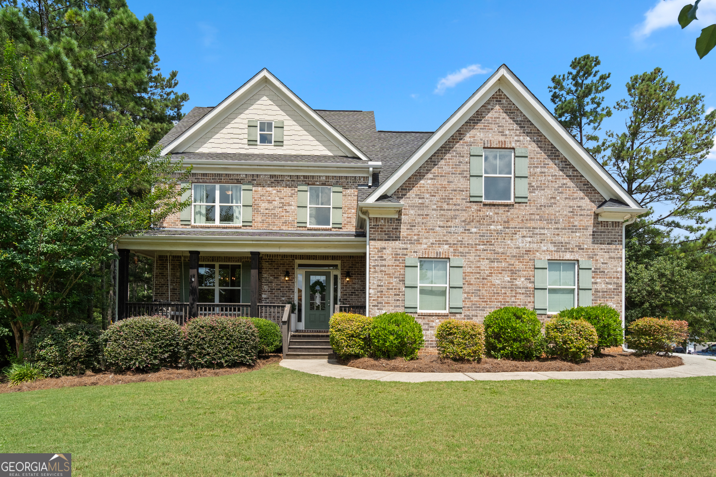 Welcome to 1200 Olympic Dr - a beautifully maintained 4-bedroom, 2.5-bath home situated on close to 2 acres, conveniently located in the desirable Walnut Grove school district and Walton County. Step inside to find beautifully beamed ceilings, hardwood floors and thoughtful upgrades throughout this stunning space. The home features both a formal dining room-perfect for hosting holidays or special gatherings-and a light-filled breakfast area, offering flexible dining options for everyday living and entertaining. The spacious family room provides a warm, inviting atmosphere and connects effortlessly to the kitchen and dining areas. Upstairs, the oversized master suite offers a private retreat with a tray ceilings, walk-in closet, and a luxurious en-suite bath complete with vaulted, beamed ceilings, double vanities, a soaking tub, and a separate shower. Three additional bedrooms, a full bath and laundry room complete the upper floor. Downstairs, the full walk-out basement is a standout feature, partially finished with both a gym and media room-perfect for fitness, fun, and relaxation. Outside is where this home truly shines. Enjoy your own private backyard oasis featuring a gorgeous gunite pool, expansive deck for outdoor dining and entertaining, and a large, fenced yard ideal for play, pets, or gardening. This rare gem offers resort-style living in one of the area's top school zones. Homes like this don't come along often-schedule your private showing today!