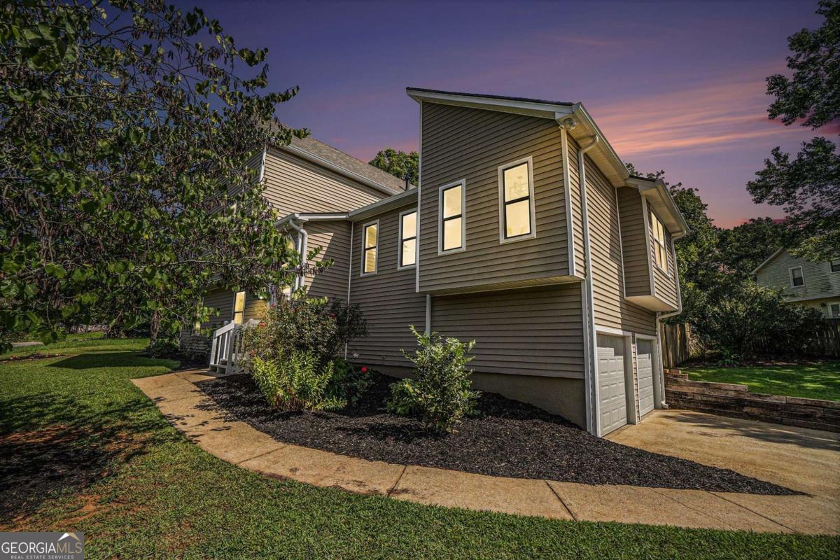 Discover this stunning, fully remodeled multi-level home that shines brighter than new! Nestled on a spacious corner lot, it features a flat driveway, a fenced backyard, a storage shed, and a dedicated garden area. The modern kitchen and bathrooms boast elegant quartzite countertops, new sinks, and stylish faucets, complemented by stainless steel appliances, including a brand-new refrigerator. A washer and electric dryer are included, with a gas hookup available for convenience. This home is packed with upgrades: a new architectural shingle roof with ridge vents, luxury vinyl flooring, plush carpet, updated lighting, new toilets, fresh paint, and more! Previously home to an above-ground pool, the small deck remains with water and electric hookups for future use. The property has been professionally treated for termites with a 5-year warranty, and a 1-year home warranty is available. Ductwork has been expertly cleaned, and new white vinyl windows will be installed in early September to replace fogged units. The fully finished lower level offers a bedroom, full bathroom, living room, and convenient access via front, rear, or garage entries. Perfectly located near schools, shopping, dining, and entertainment, this home is ready for you to move in and enjoy!