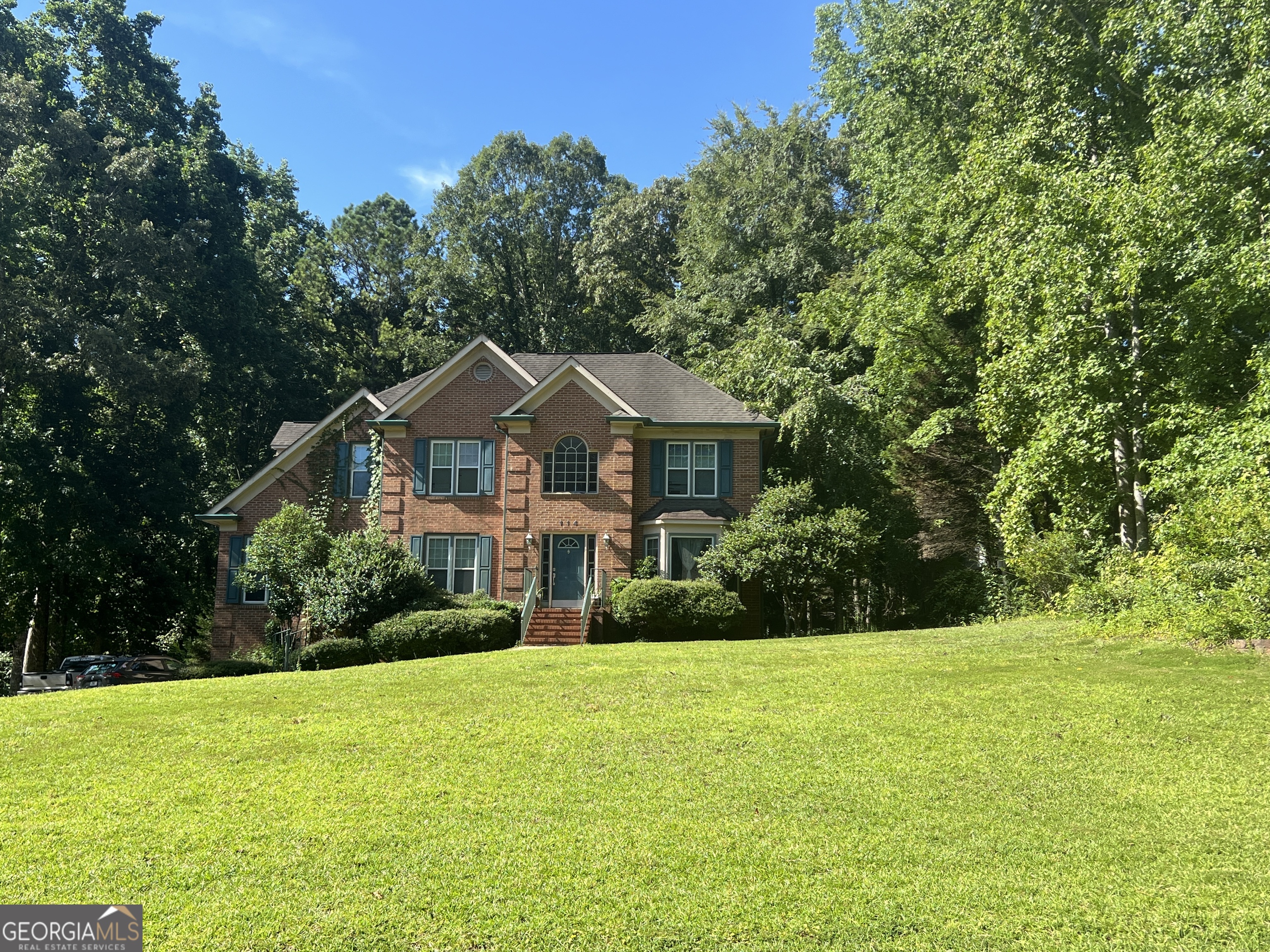 Large traditional home with partial finished basement. Features beautiful 2-story foyer, 4 bedrooms, 3 1/2 baths, Master suite on main level, walk in closet, large master bath with double vanities, soaking tub and separate shower. Family room with vaulted ceiling and fireplace. Separate den and dining room. Kitchen with eat in breakfast area and loads of natural light from all the windows, all appliances remain. Bonus room and full bath in basement. 2 car garage with lots of storage. Back deck overlooks a large back yard. New Heating and Air units with smart thermostats and a 10-year warranty (2025). New garage door motors and track (2024). Gutters with leaf guard system.