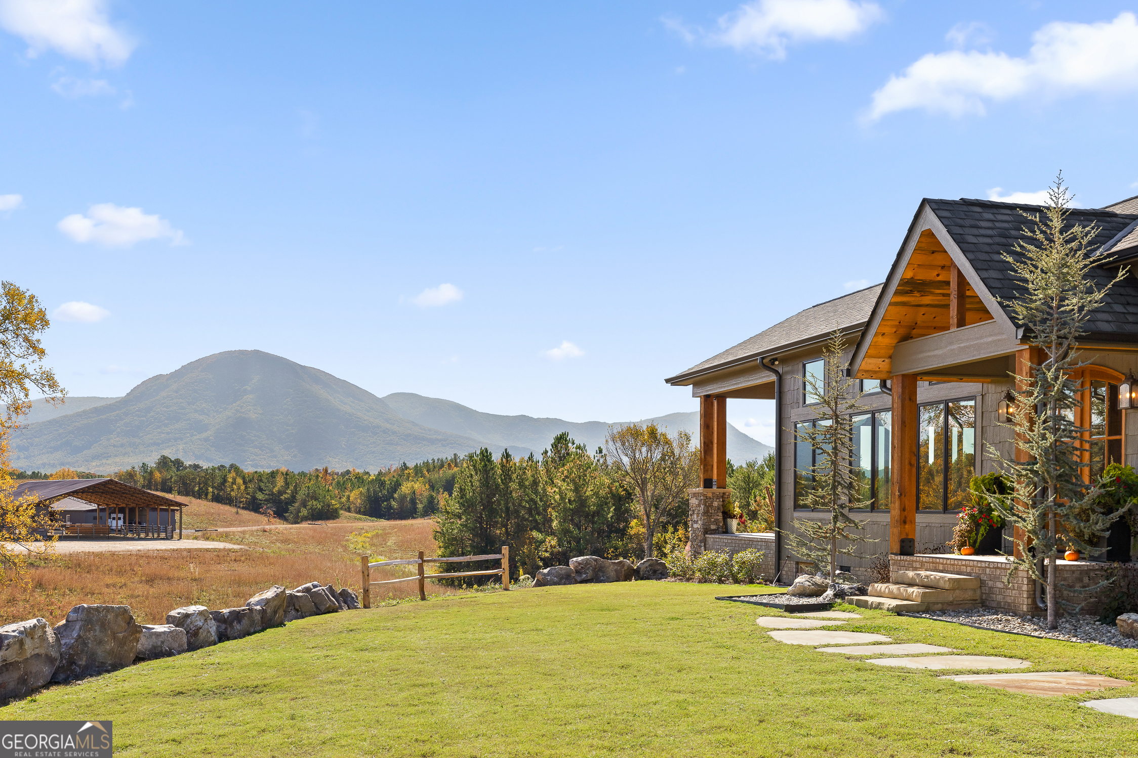 Welcome to Four C's Equestrian Estate, a 101-acre rustic haven surrounded by breathtaking mountain views located in the charming town of Chatsworth! This is truly a once-in-a-lifetime opportunity where the rugged beauty of Yellowstone converges with the serene landscapes of Georgia. Every aspect of this property has been meticulously crafted to fulfill the desires of any hunter, equestrian, or outdoor enthusiast. Boasting 12 distinct structures scattered across the 101 acres, each designed with modern amenities and unique characteristics to enhance your western lifestyle. Take in the serenity of the 3-acre stocked lake only steps from the cozy guest home and cook house creating the perfect setting for family gatherings or entertaining guests. The state-of-the-art center aisle barn features four spacious stalls with 36ft runs, auto water, and vulcanized rubber stall matts. Refine your riding skills in the 60'x80' covered arena, complete with a cutting-edge mechanical cow training system. Afterward, unwind in the adjacent Saloon, a perfect retreat to savor a refreshing beverage following a hot summer day. Step into the newly crafted main house where a fully-custom design and attention to detail blend seamlessly, creating an atmosphere of refined elegance and relaxation. Locally sourced, reclaimed materials filled with history and milled solid woods create a rustic ambiance throughout the home accented by the large, expansive windows showcasing the breathtaking view from almost every room. Whether you envision a Montana-inspired dude ranch, a five-star homestead, a sprawling family compound, or a lucrative venue for memorable events, Four C's Equestrian Estate gracefully adapts to your aspirations. The absence of a conservation easement grants you the freedom to further develop this spectacular property, situated within convenient reach of Atlanta, Chattanooga, Blue Ridge, and Ellijay. Take advantage of this rare opportunity to own Four C's Equestrian Estate where rustic elegance meets a true western lifestyle to forge a legacy of unforgettable stories.