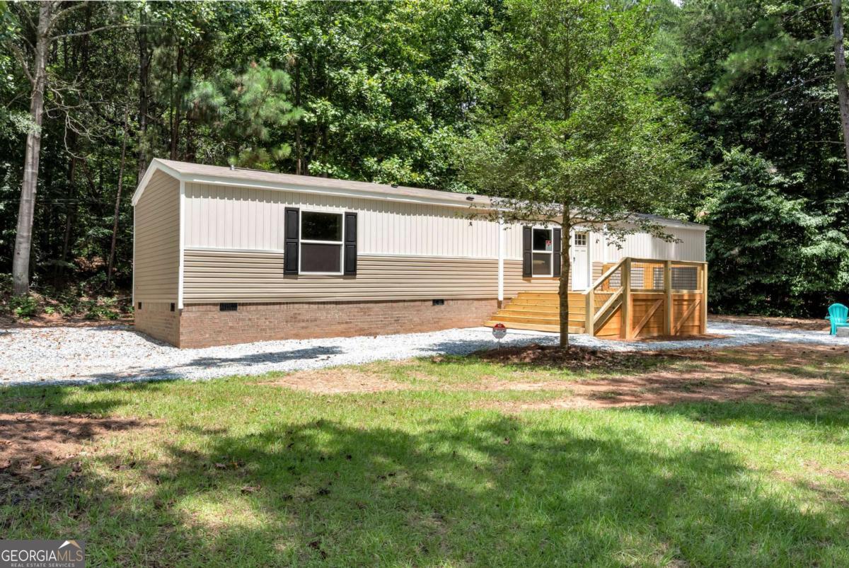 Are you dreaming of a tranquil home by the lake? This immaculate mobile home is move-in ready and boasts a wealth of fantastic features, all just steps from stunning Lake Hartwell! **Property Highlights:** - 2 Bedrooms / 2 Full Baths - Versatile bonus room that can easily serve as a 3rd bedroom - Expansive kitchen island with double pantries for ample storage - Partially furnished-just bring your essentials and settle in! - Nestled on a generous 1/2 acre lot - Only 5 minutes away from 3 convenient boat ramps - Less than 0.5 miles from the popular Gumlog BBQ - Close proximity to Tugalo State Park for outdoor adventures - A short walk to the scenic shores of Lake Hartwell Whether you seek a year-round residence, a cozy weekend retreat, or an income-generating rental, this property perfectly combines location and comfort. Don't let this opportunity pass by-schedule your showing today!