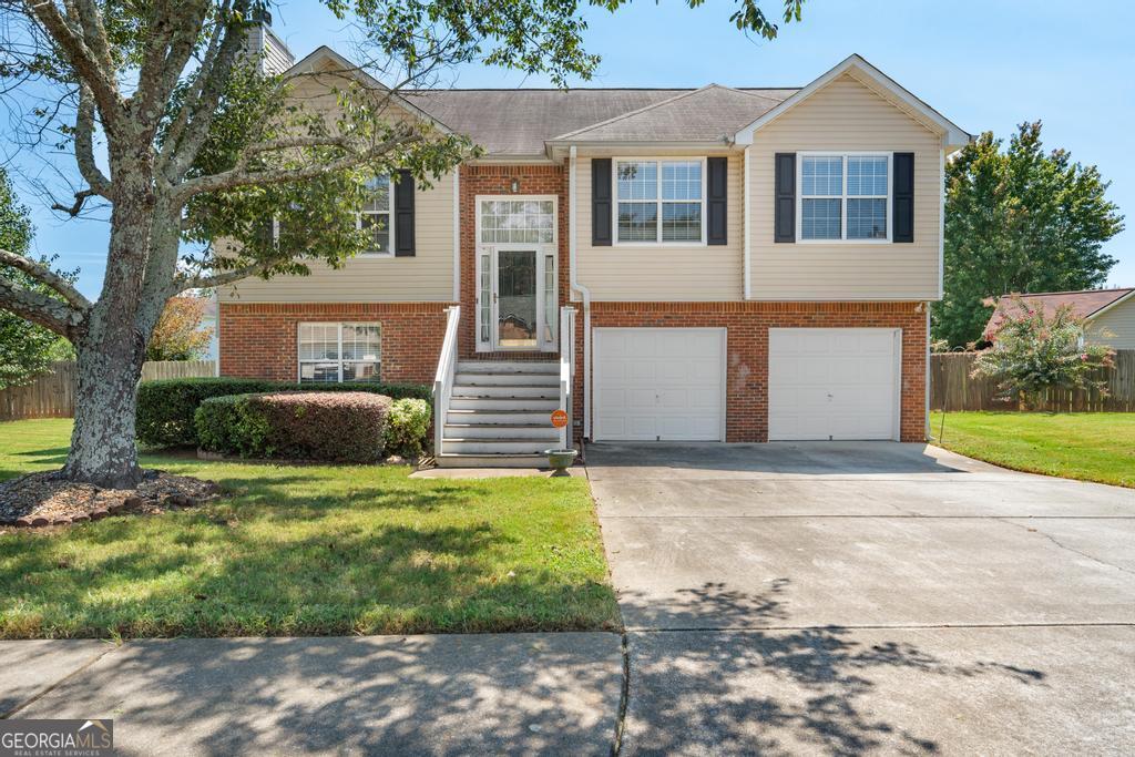 Spacious and move in ready... this adorable spit level in Callaway Village is waiting for you. It has 4 Bedrooms / 3 Full bathrooms. Step inside this split level and go up the stairs where you'll immediately enter the living room including a fireplace open to the dining room and kitchen with a back door to allow for you to step outside onto the deck. Head down the hall where you'll find the Primary bedroom, walk in closet, primary bathroom and 2 more spacious bedrooms and additional hall bathroom. As you head downstairs, you'll find the laundry closet, a 4th bedroom and full bathroom suite and a private flex space for sitting area /media room or office. Two car garage and off the back of the garage is a huge garage storage room that leads outside to the fenced in private back yard. This home is priced to sell and ready to go.